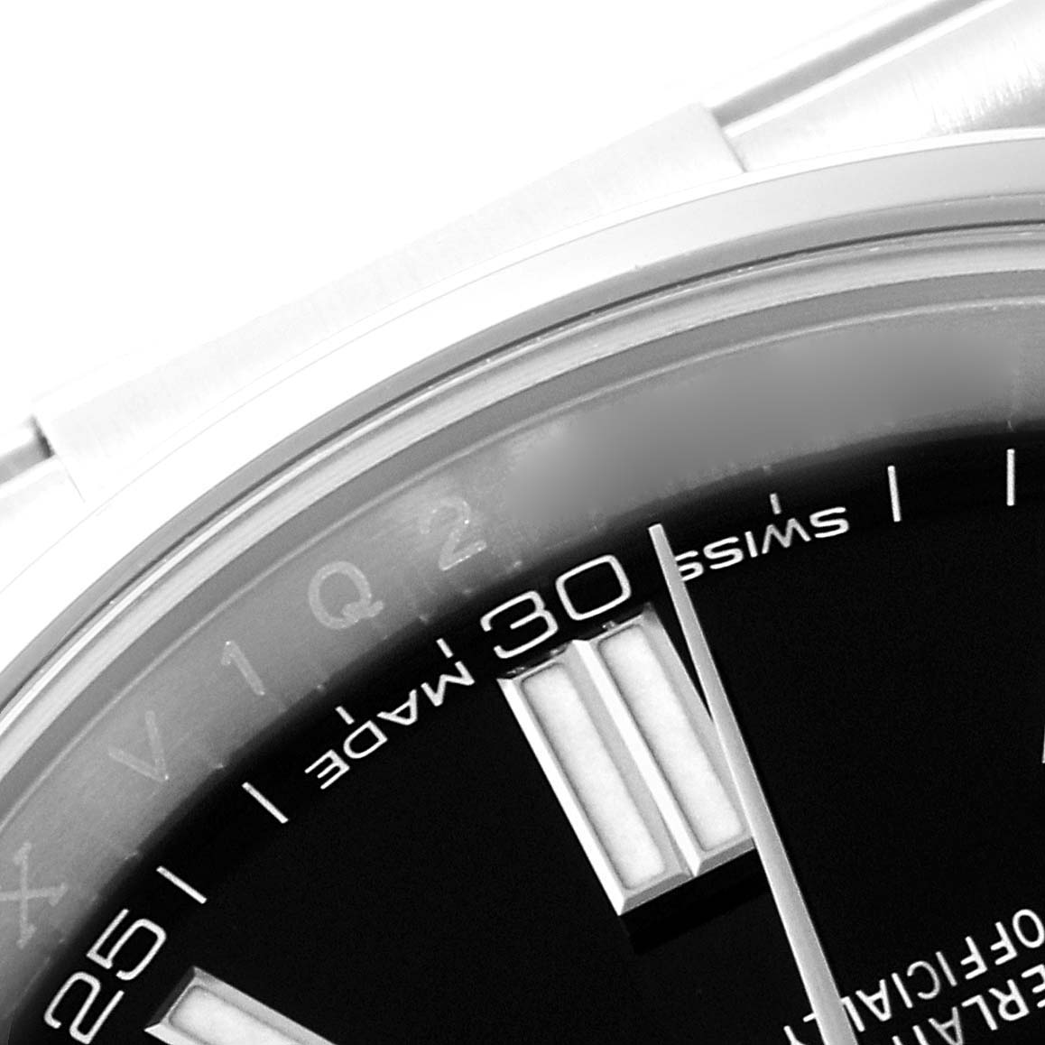 This image shows a cropped close-up of the dial and bezel of a Rolex Oyster Perpetual 116000 Men's Stainless Steel Black Dial 116000 Men's Stainless Steel Black Dial watch, featuring the "Swiss Made" text and part of the minute markers.