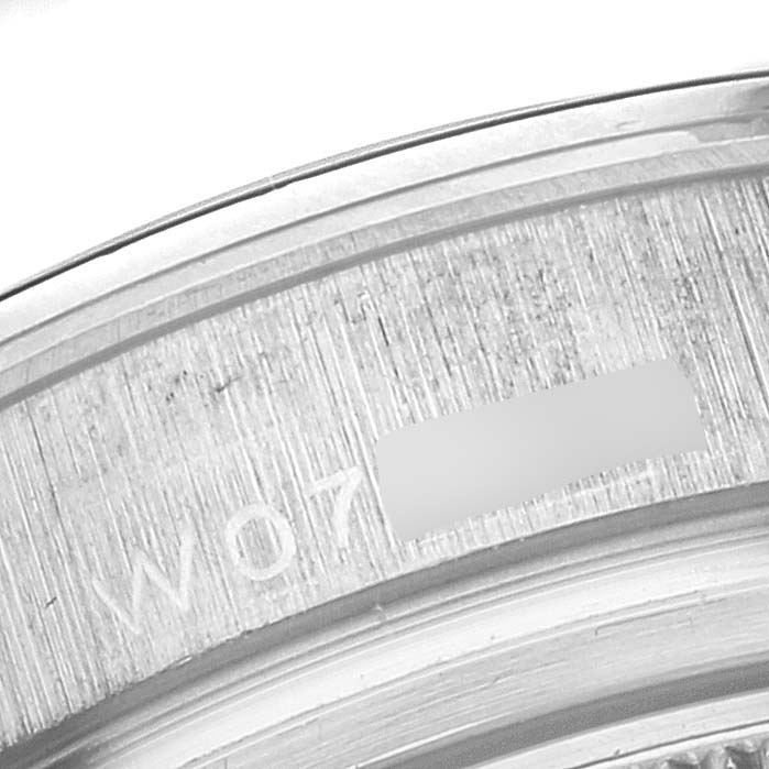 This close-up image displays the engraved serial number on the inner rim of a Rolex Pearlmaster 69329 Women's White Gold Mother of Pearl Dial 69329 Women's White Gold Mother of Pearl Dial watch.