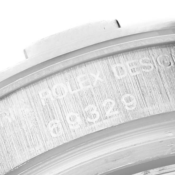 The image shows a close-up of the engraved inner rim of the Pearlmaster model by Rolex, detailing part of the serial number.