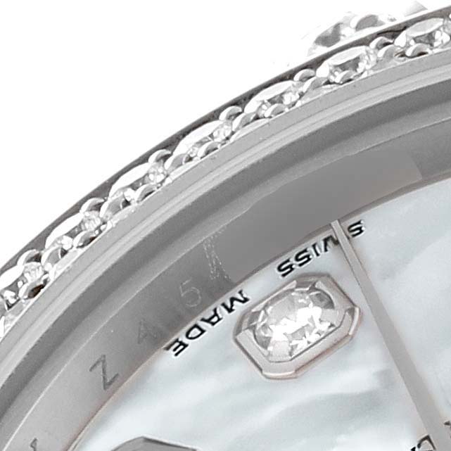 This close-up image of a Rolex Pearlmaster 80359 Women's White Gold Mother of Pearl Dial 80359 Women's White Gold Mother of Pearl Dial watch shows the bezel with diamonds and part of the dial with a "SWISS MADE" marking.