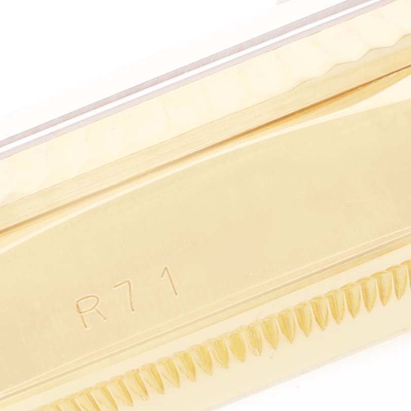 This is an extreme close-up of the textured gold bezel of a Rolex President 18238 Men's Yellow Gold Champagne Dial 18238 Men's Yellow Gold Champagne Dial model watch with the "R71" engraving visible.