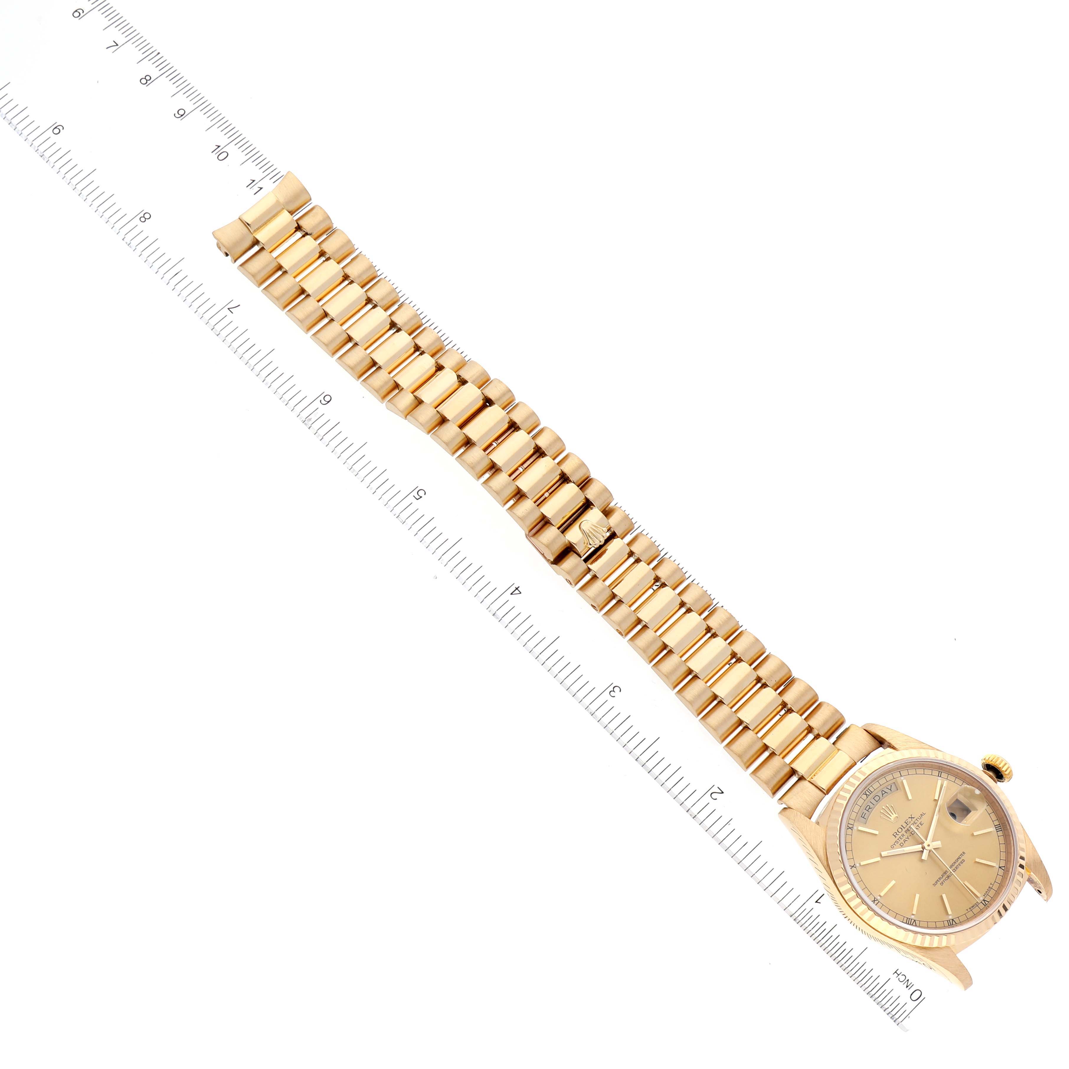 The image shows a Rolex President 18238 Men's Yellow Gold Champagne Dial 18238 Men's Yellow Gold Champagne Dial model watch laid flat with a ruler beside it for scale, displaying the bracelet and face.