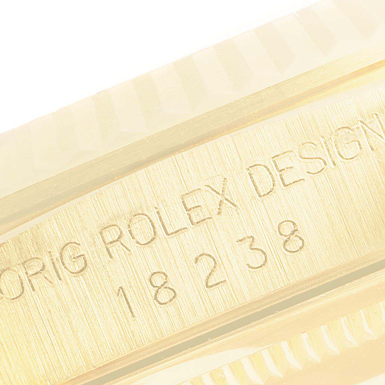 The image shows a close-up of the gold case edge on a Rolex President 18238 Men's Yellow Gold Champagne Dial 18238 Men's Yellow Gold Champagne Dial model, displaying engraved details and model number.