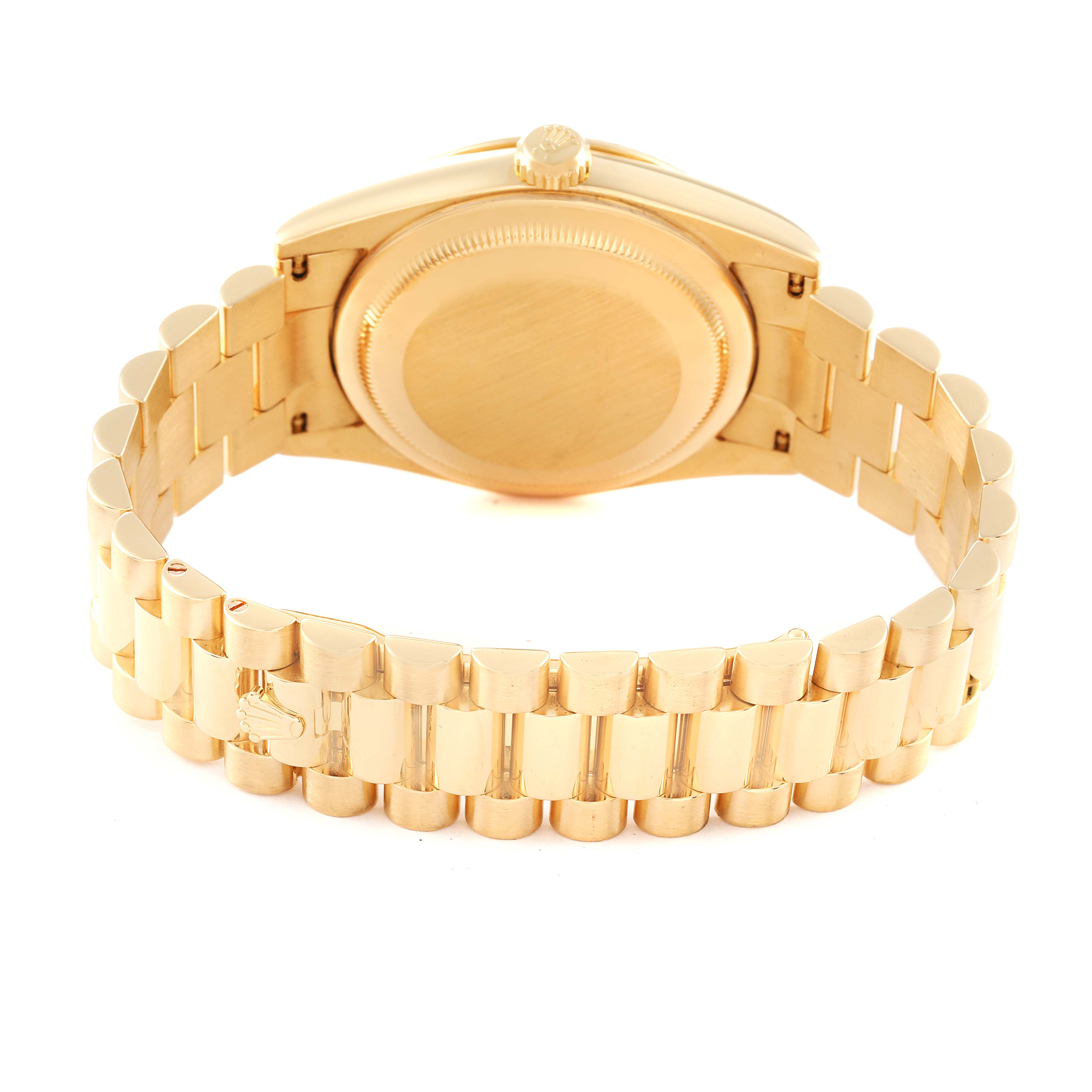 The Rolex President 118338 Men's Yellow Gold  118338 Men's Yellow Gold  model watch is shown from the back, displaying the case back and the gold bracelet.
