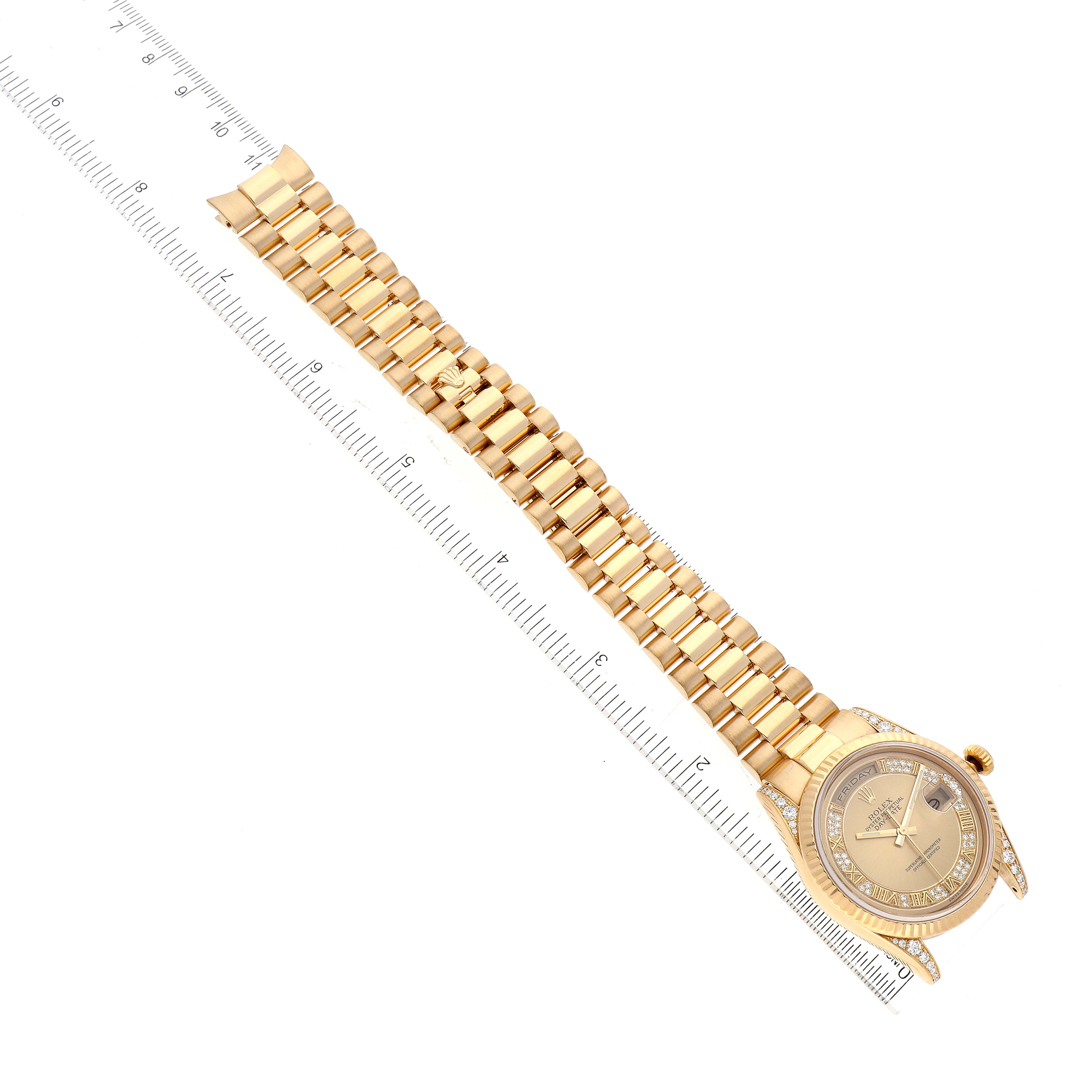 The image shows a gold Rolex President 118338 Men's Yellow Gold  118338 Men's Yellow Gold  model watch with its face and bracelet view, displayed at an angle with a ruler for scale.