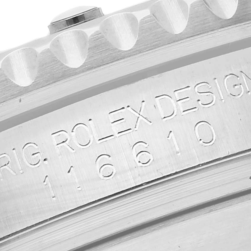 This close-up image shows the engraved bezel and part of the case of a Rolex Submariner 116610 Men
s Stainless Steel Black Dial 116610 Men
s Stainless Steel Black Dial watch.