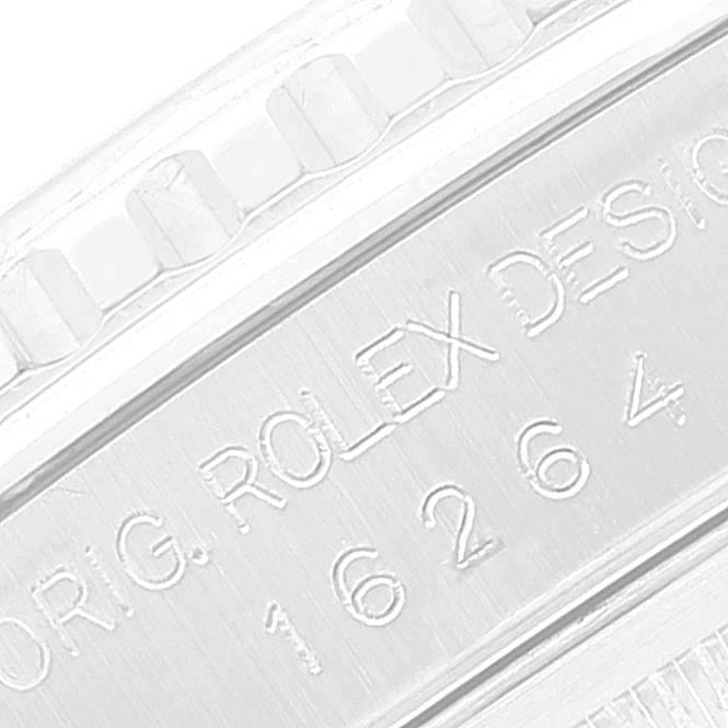 The image shows a close-up of the engraved casing of a Rolex Datejust 16264 Men's Stainless Steel Silver Dial 16264 Men's Stainless Steel Silver Dial watch, highlighting the model number and brand.