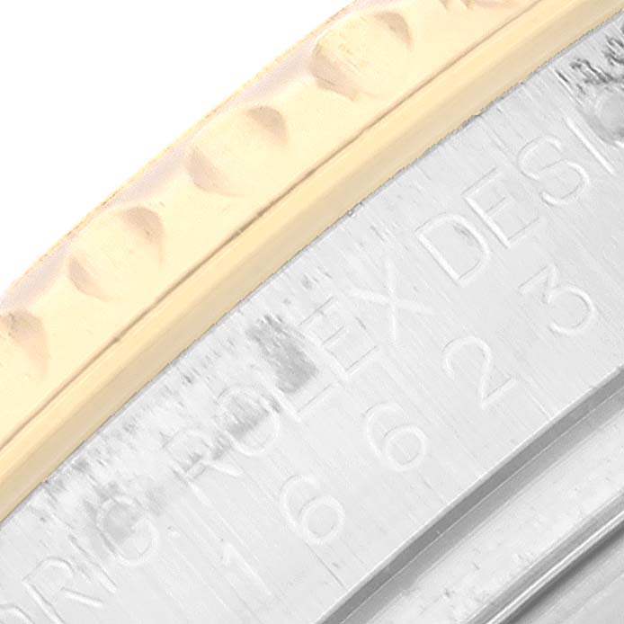 This close-up image shows the bezel and engraved side of the Rolex Yacht-Master 16623 Men
s Steel and Gold (two tone) Blue Dial 16623 Men
s Steel and Gold (two tone) Blue Dial watch.