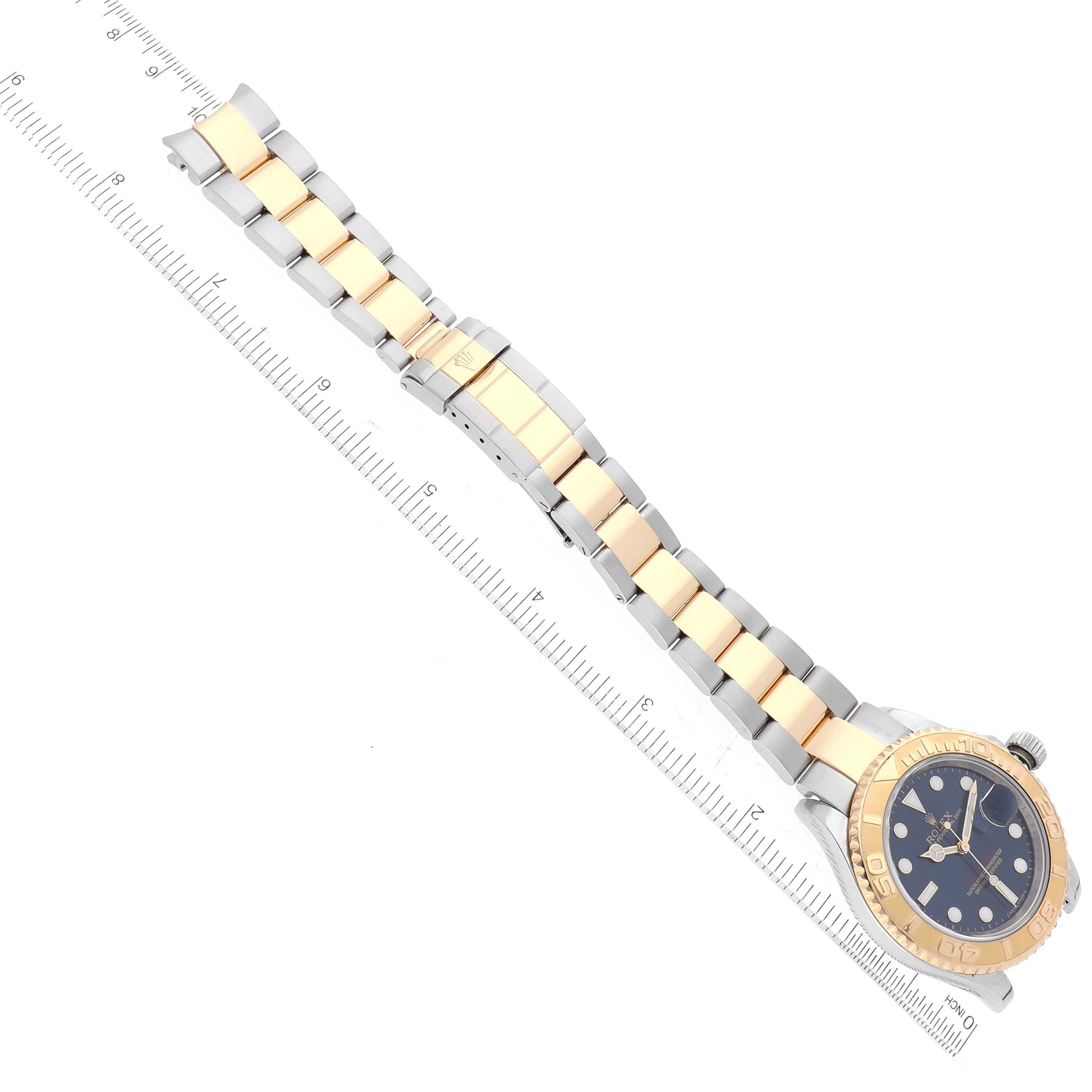 The image shows a top-down view of a Rolex Yacht-Master 16623 Men
s Steel and Gold (two tone) Blue Dial 16623 Men
s Steel and Gold (two tone) Blue Dial watch, displaying its bracelet, case, and face.