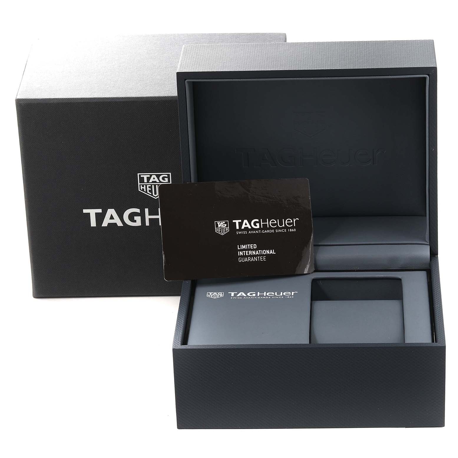 The image shows a Tag Heuer Carrera CAR2A1Z.FT6044 Men's Stainless Steel Transparent Dial CAR2A1Z.FT6044 Men's Stainless Steel Transparent Dial watch box, open to display the warranty card and internal compartments.