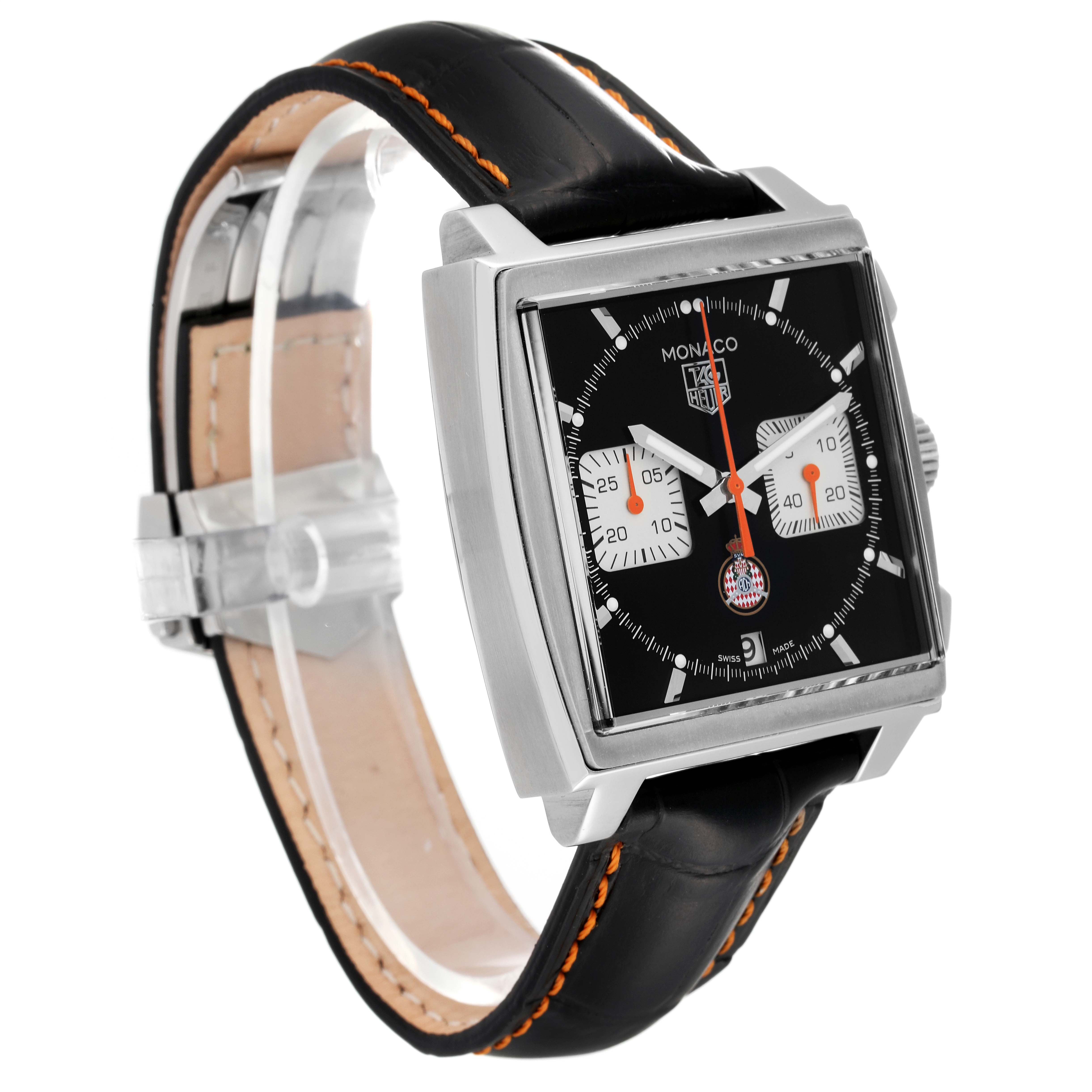The image shows a three-quarter view of the Tag Heuer Monaco Limited Edition watch, featuring a black dial, square case, and black leather strap.