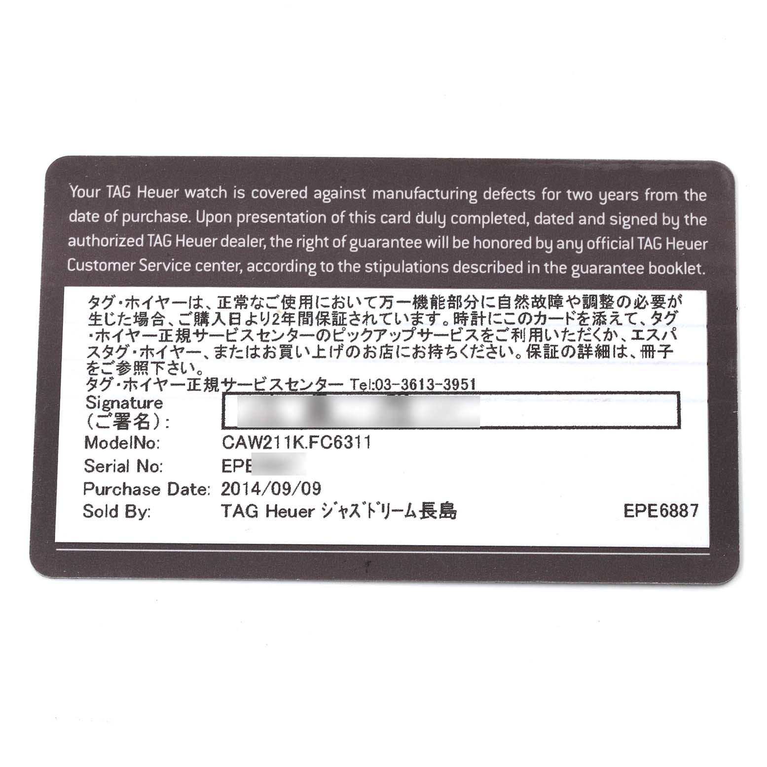 The image shows a close-up of the warranty card for the Tag Heuer Limited Edition CAW211K.FC6311 Men
s Stainless Steel Black Dial CAW211K.FC6311 Men
s Stainless Steel Black Dial model CAW211K.FC6311.