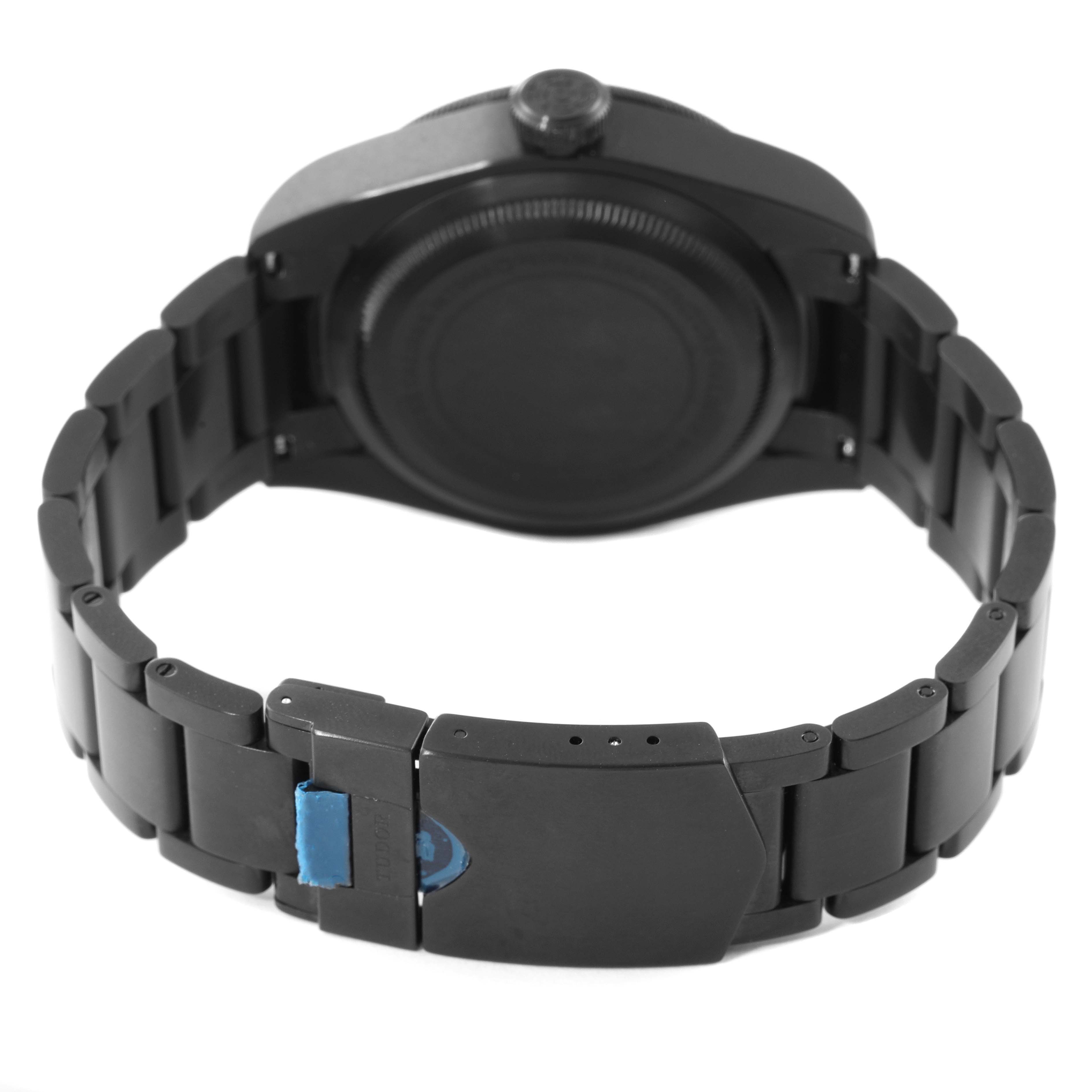 This is the back view of a Tudor Heritage Black Bay 79230DK Men's Stainless Steel Black Dial 79230DK Men's Stainless Steel Black Dial watch showcasing its stainless steel bracelet and clasp.