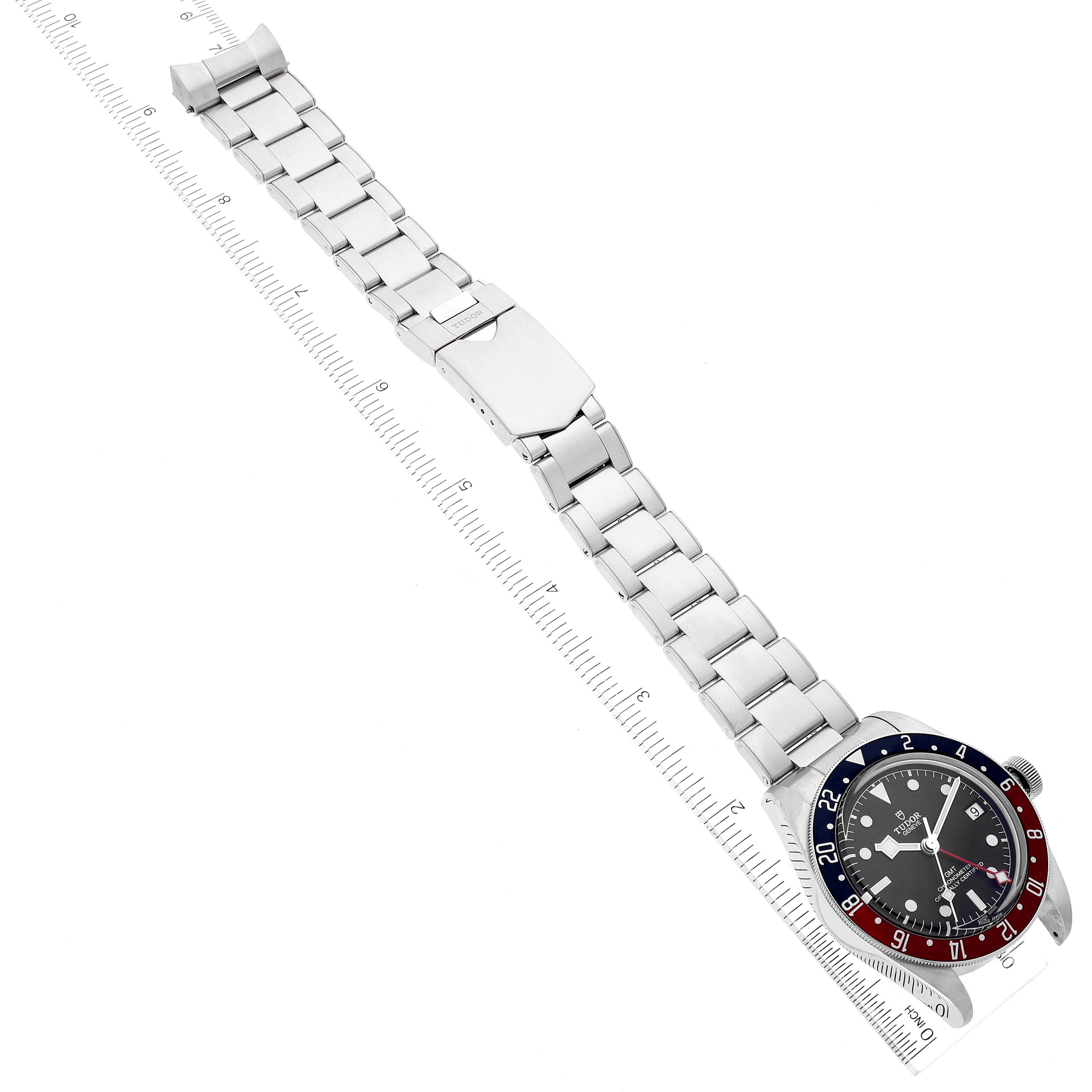 The image shows a top-down view of the Tudor Heritage Black Bay 79830RB Men's Stainless Steel Black Dial 79830RB Men's Stainless Steel Black Dial watch with its stainless steel bracelet fully extended.