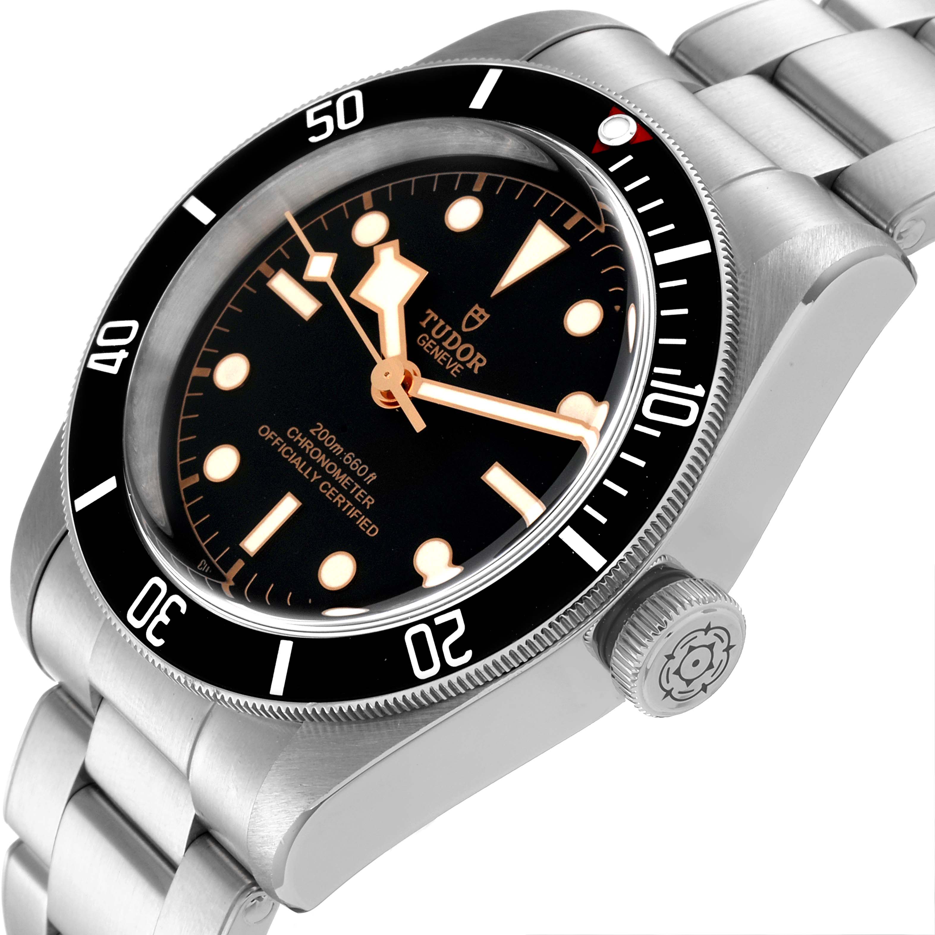 The image shows a Tudor Heritage Black Bay 79230 Men's Stainless Steel Black Dial 79230 Men's Stainless Steel Black Dial watch angled to display its face, bezel, crown, and stainless steel bracelet.