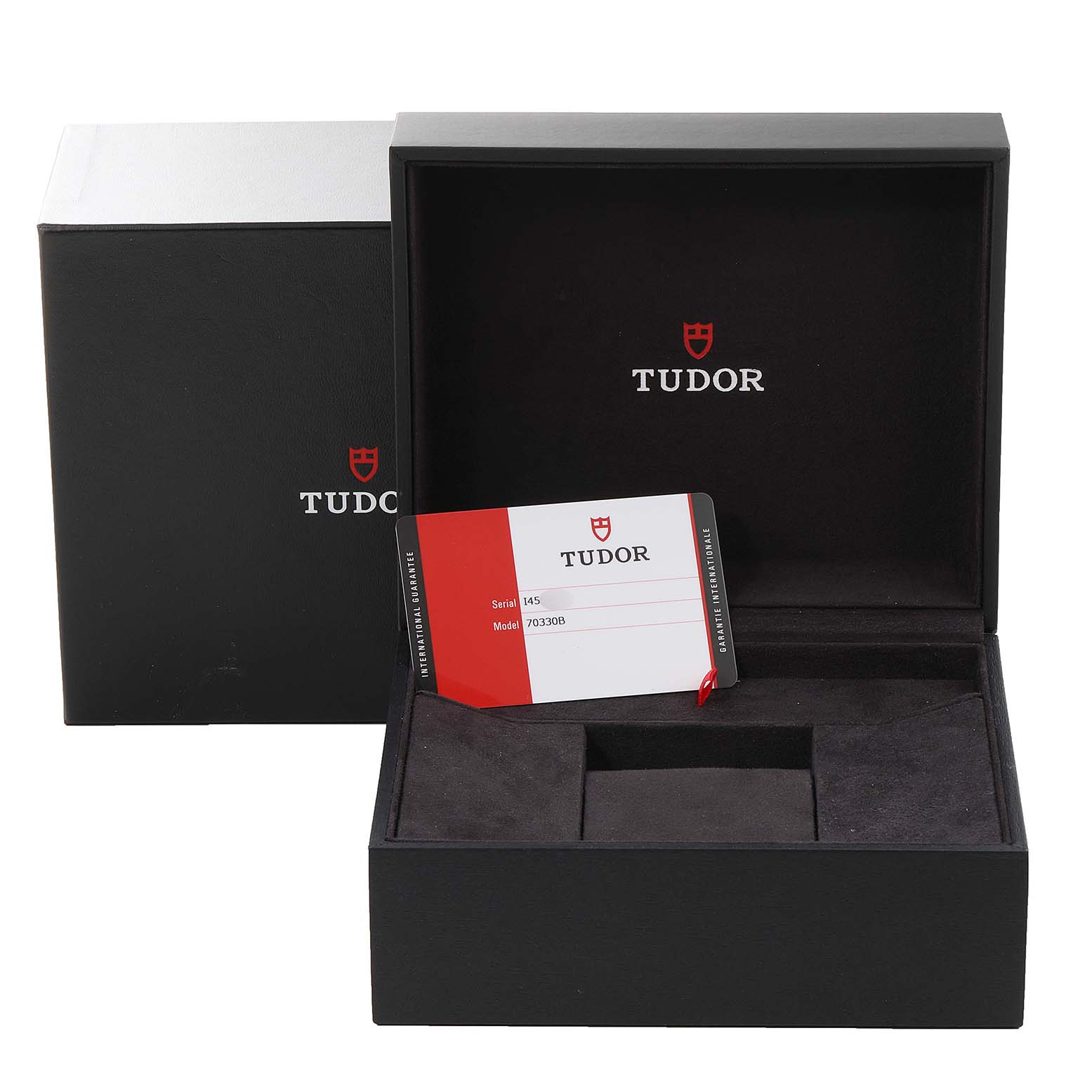 This image shows an open Tudor Heritage Chrono 70330B Men's Stainless Steel Blue Dial 70330B Men's Stainless Steel Blue Dial watch box with its model card visible inside.