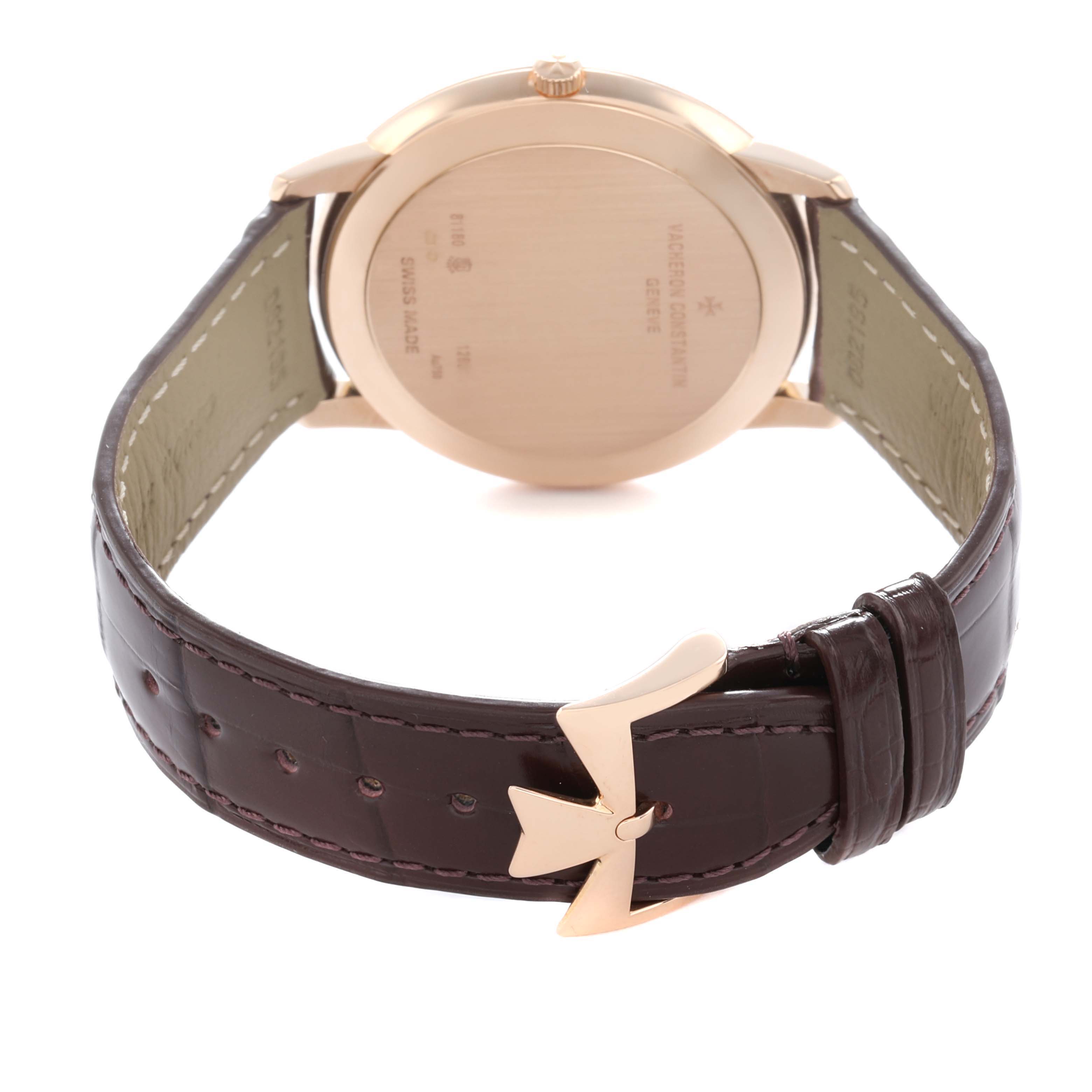 The Vacheron Constantin Patrimony 81180 Men
s Rose Gold Silver Dial watch is shown from the back, displaying the case back and brown leather strap with a distinct buckle.
