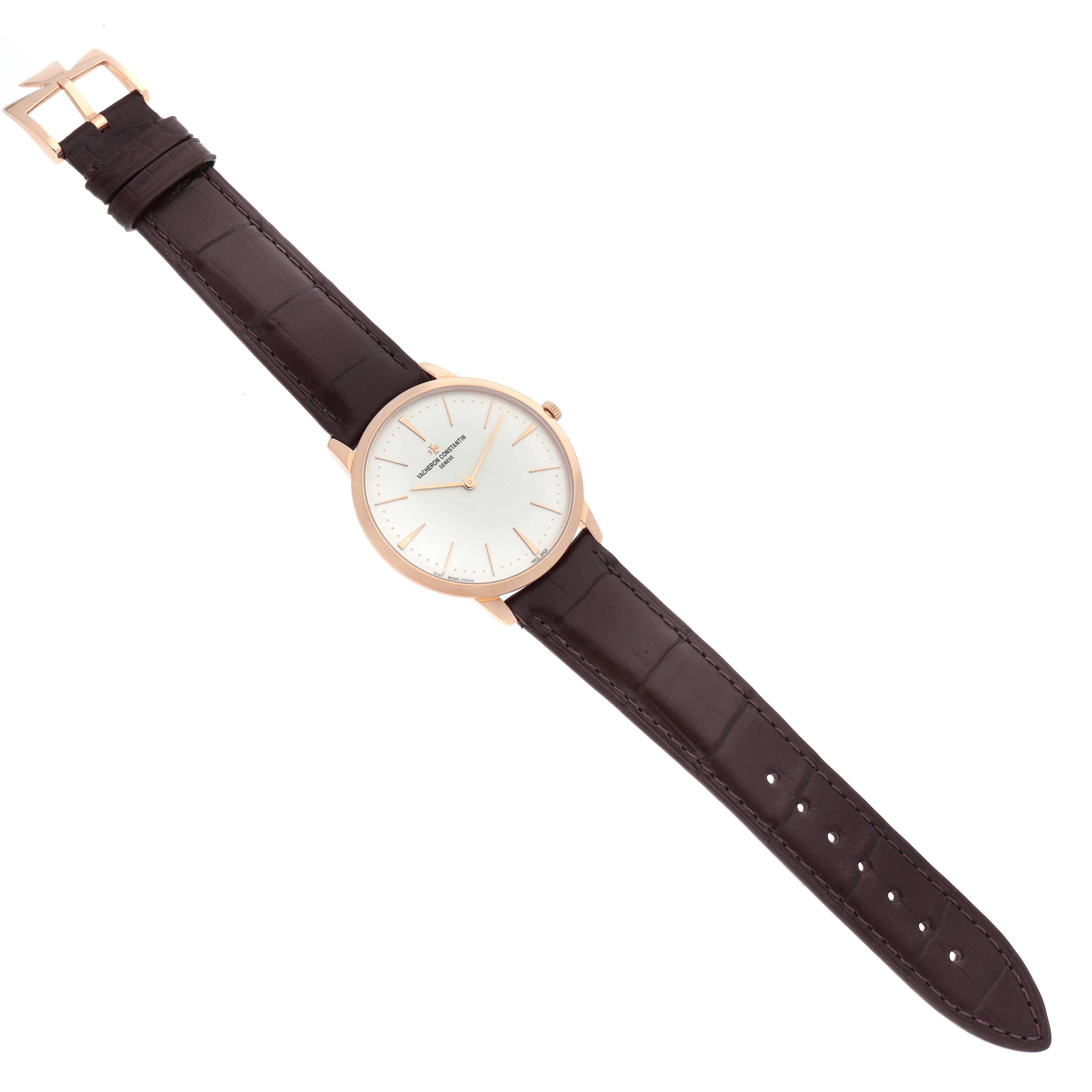 The image shows a Vacheron Constantin Patrimony 81180 Men
s Rose Gold Silver Dial watch laid flat, highlighting the dial, leather strap, and buckle.