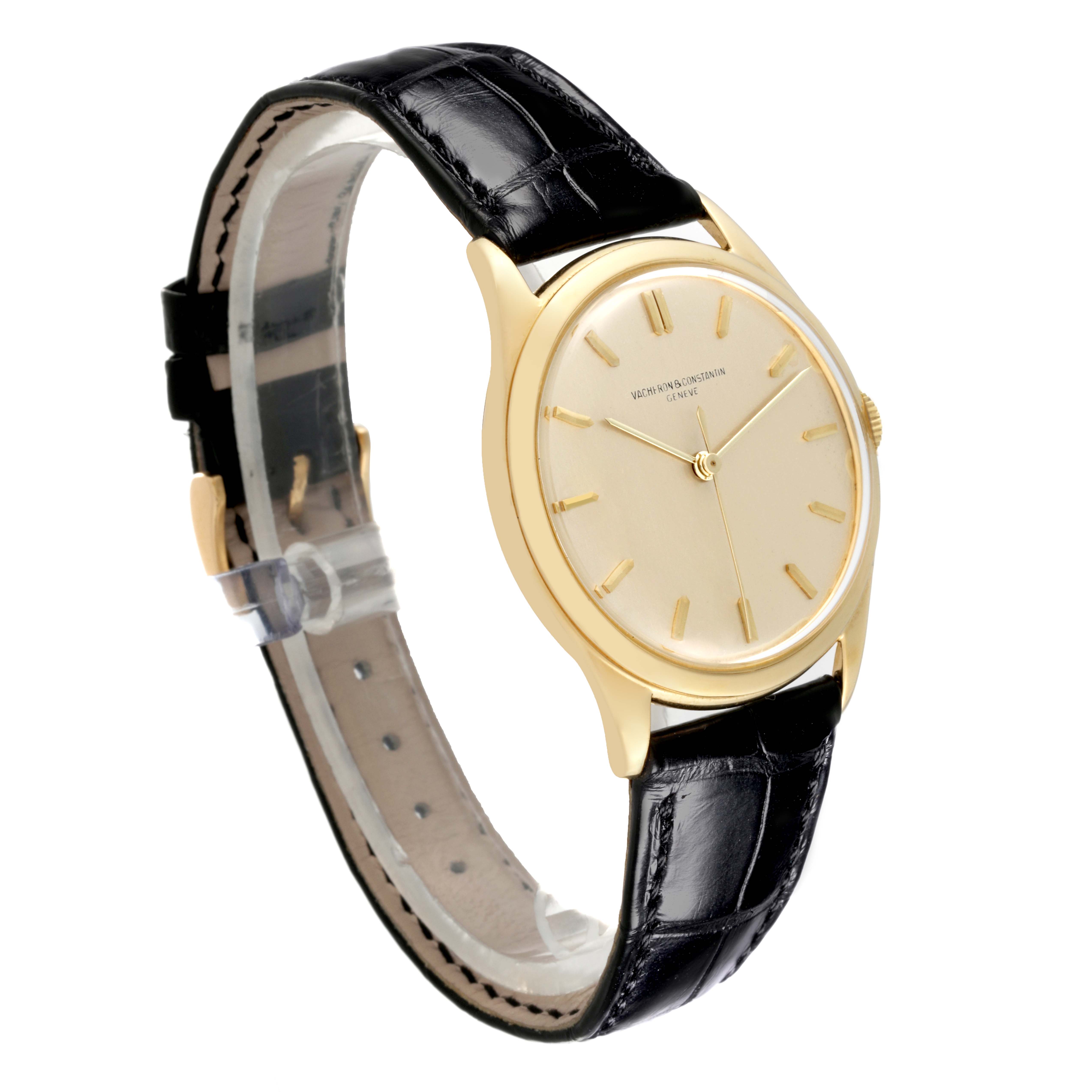 The Vacheron Constantin Vintage Men's Yellow Gold Silver Dial Men's Yellow Gold Silver Dial watch is shown from a three-quarter angle, highlighting its dial, gold case, and black leather strap.