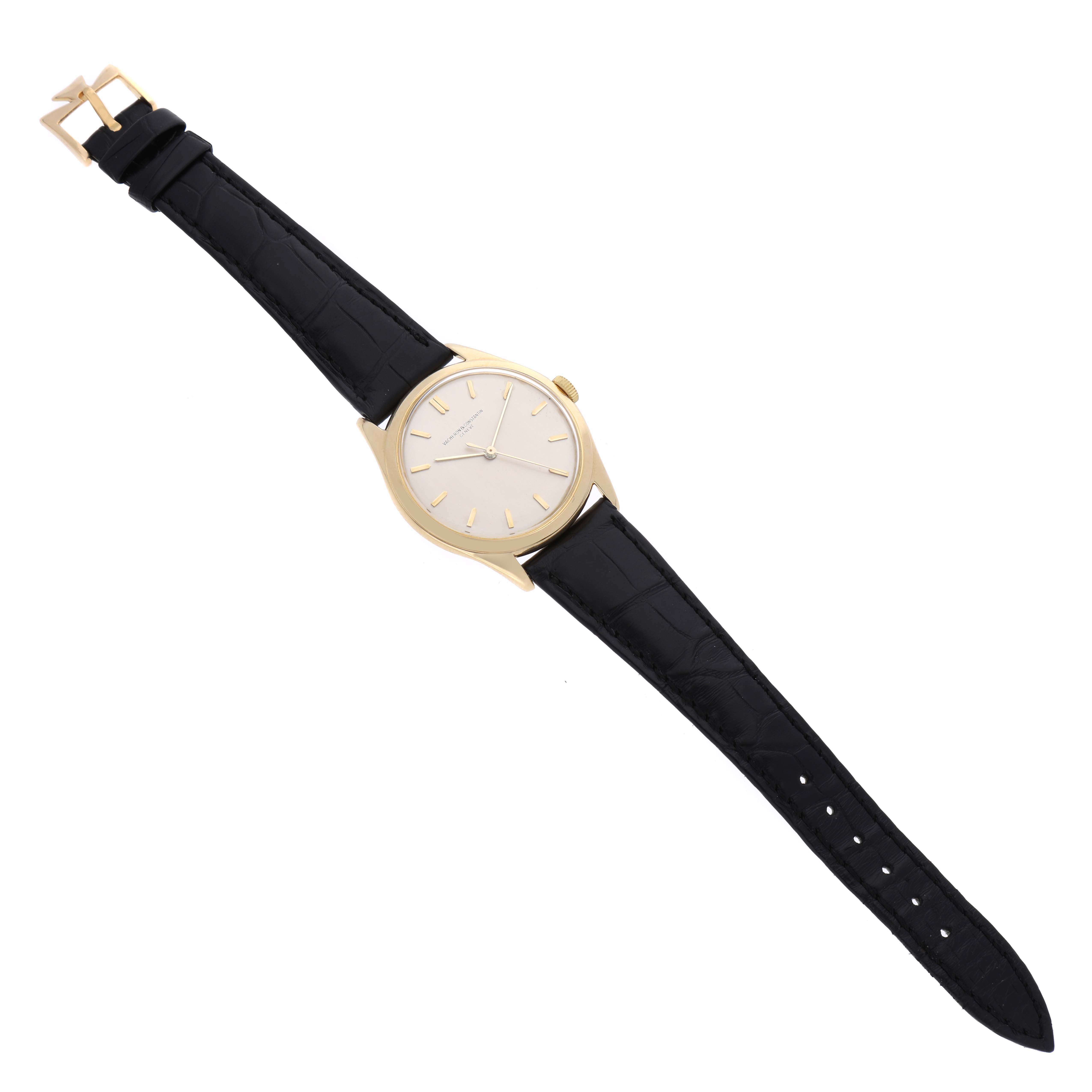 The watch is a Vintage Vacheron Constantin, shown from a top-down angle displaying the entire strap and face.