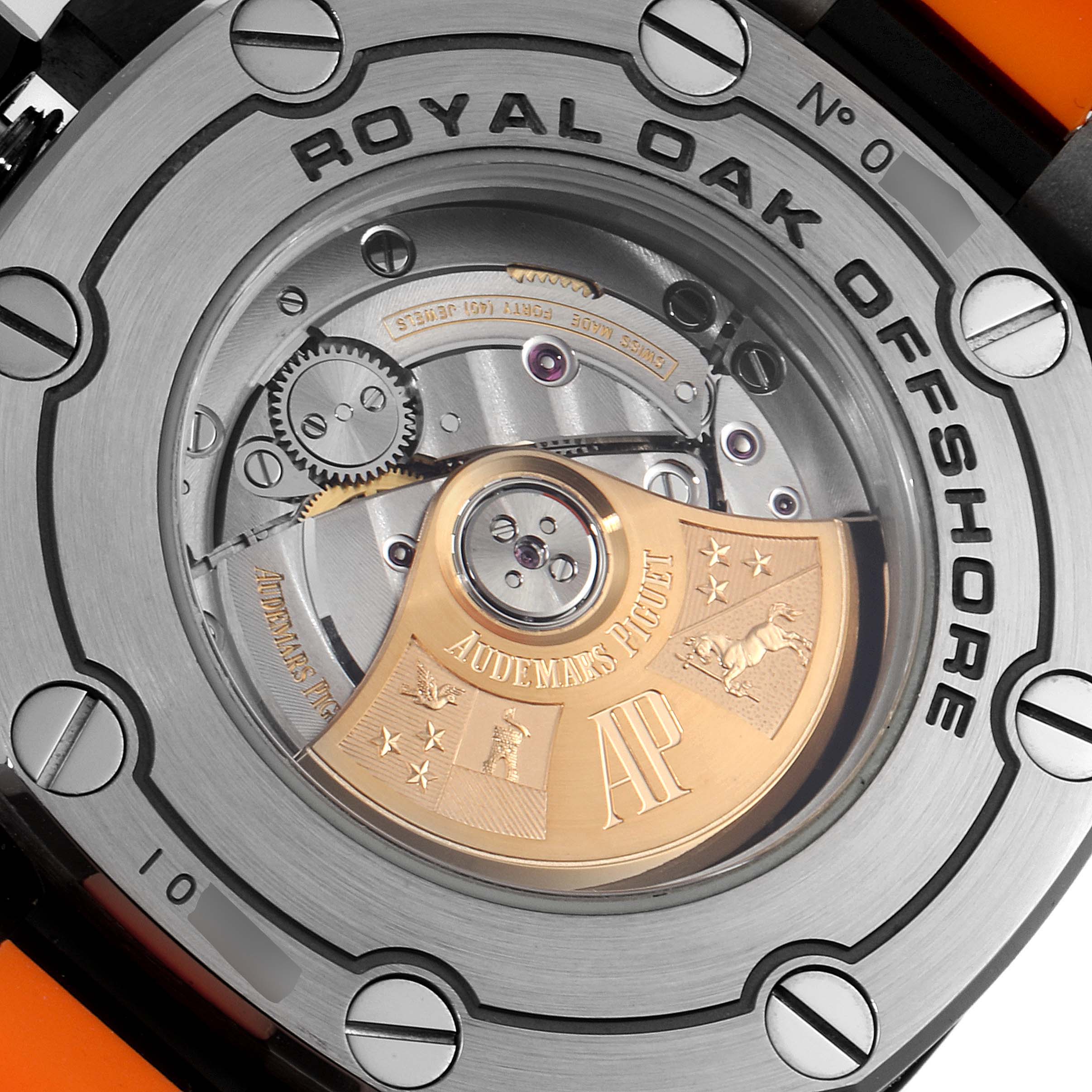 The image shows the case back and movement of a Royal Oak Offshore model by Audemars Piguet, highlighting its intricate mechanics.