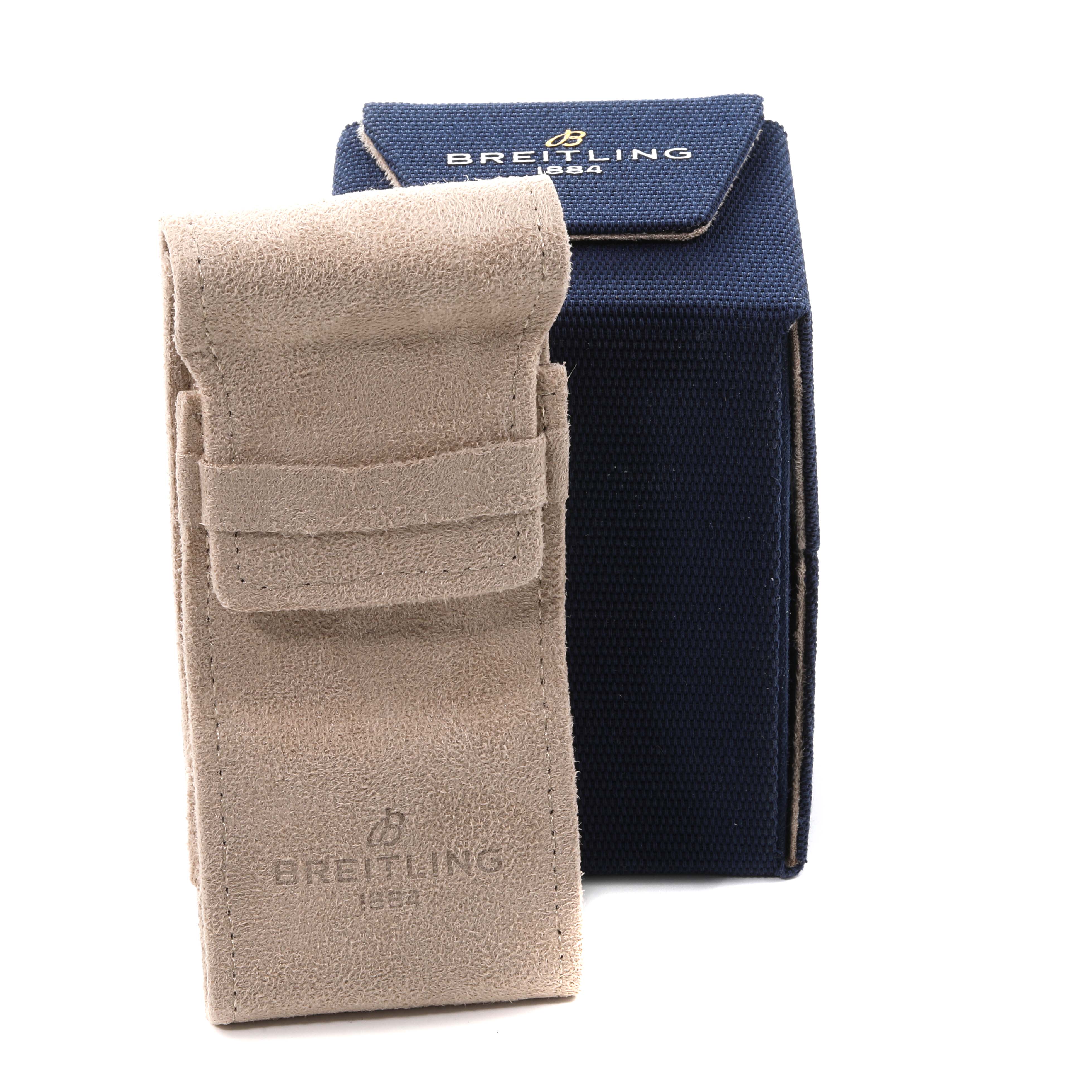 The image shows a beige pouch and a blue box, both branded Breitling, intended for the Superocean model watch.