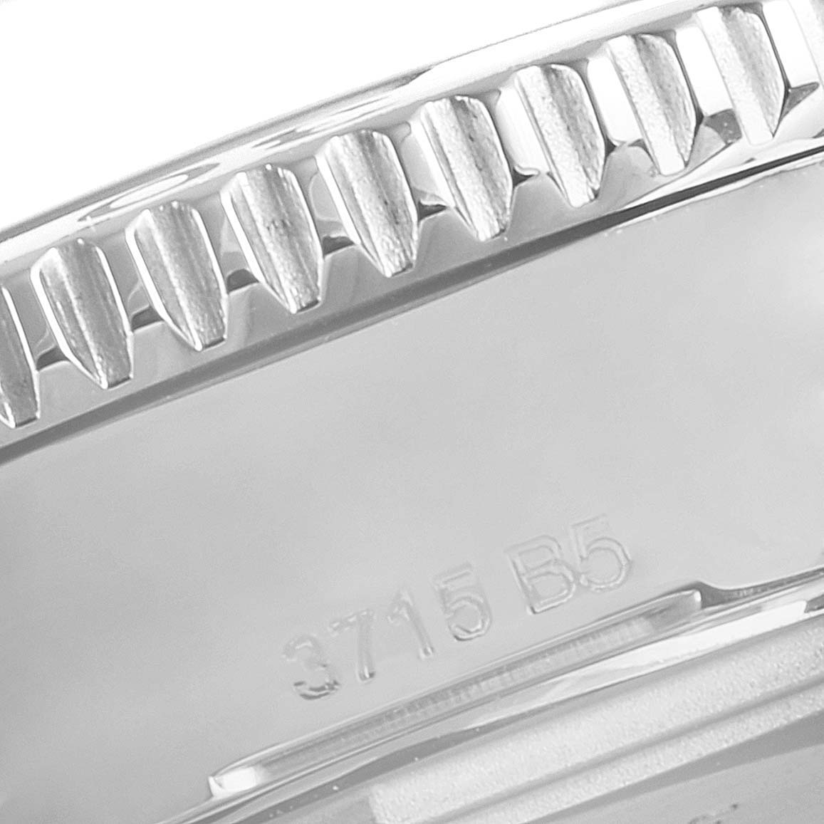 The image shows a close-up of the bezel and part of the case back of the Breitling A17312 Women's Stainless Steel White Dial A17312 Women's Stainless Steel White Dial Superocean II 36 Hurricane White Dial Ladies Watch A17312.