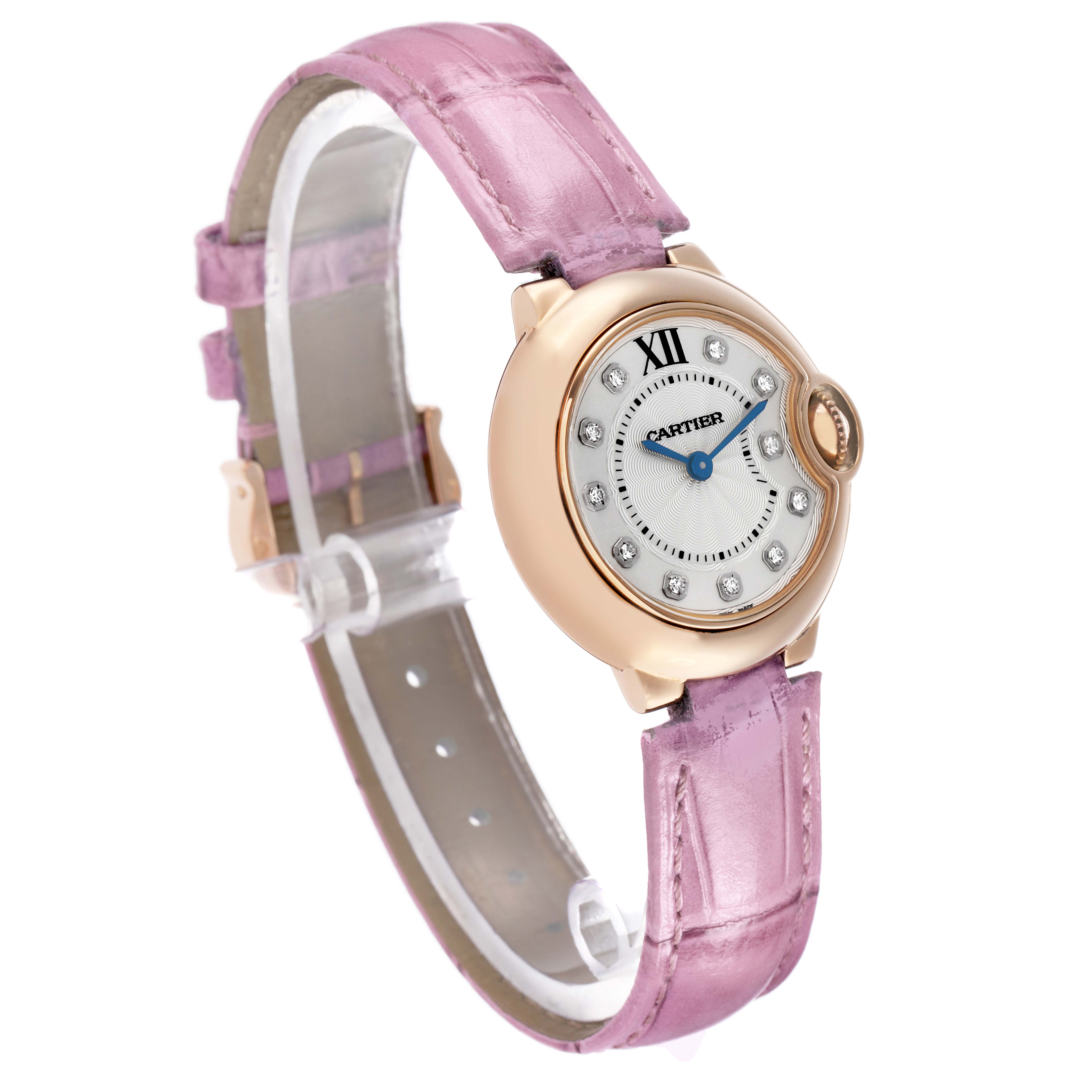 The Ballon Bleu by Cartier is shown at a slight angle, highlighting the face, case, and pink strap.