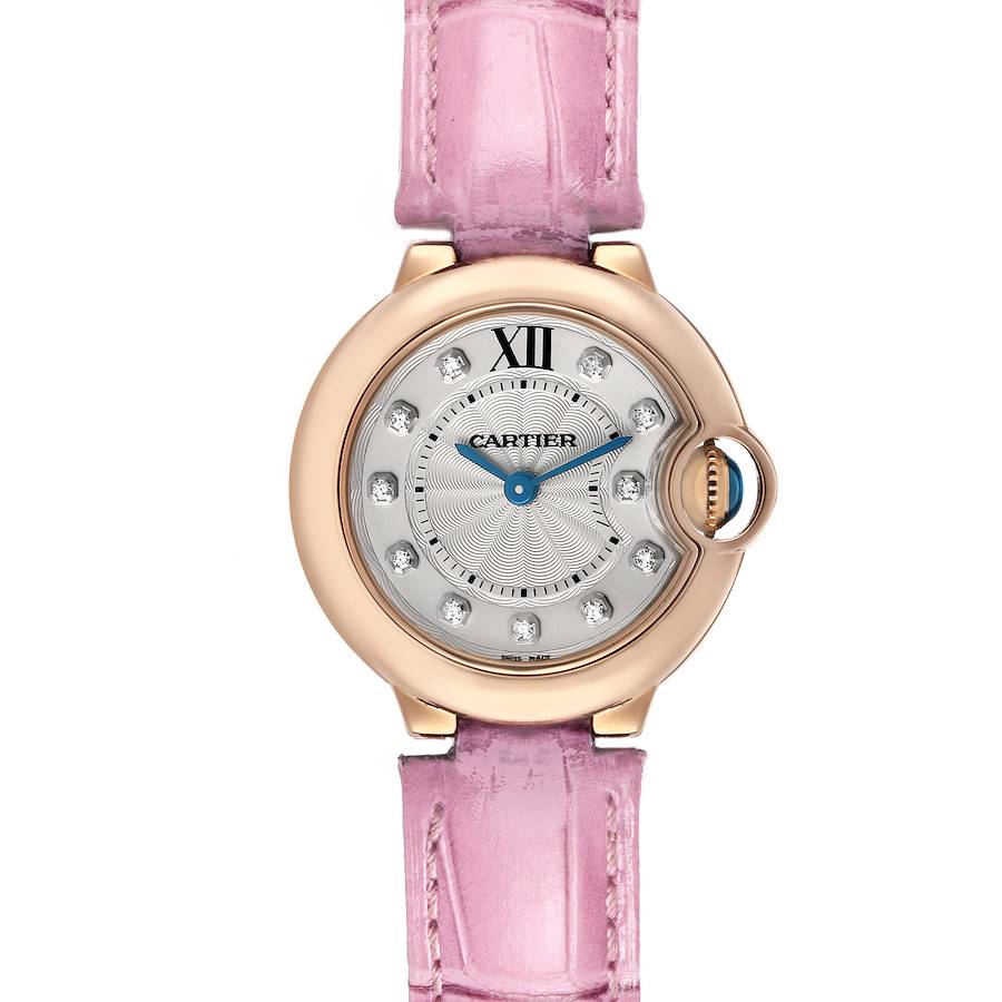 The Cartier Ballon Bleu WE902050 Women's Rose Gold Silver Dial watch is shown from a top-down angle, highlighting the face, pink strap, and diamond hour markers.