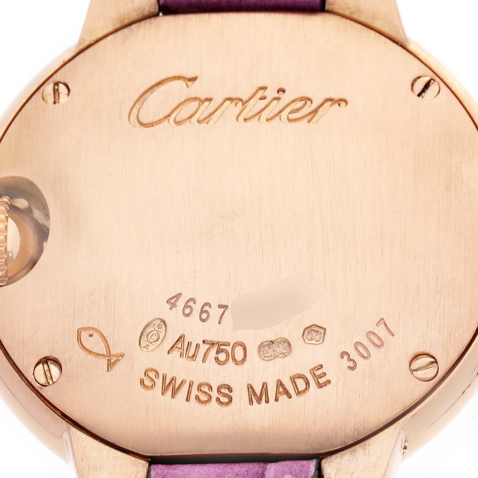 This image shows the back of a Cartier Ballon Bleu WE902050 Women's Rose Gold Silver Dial watch, highlighting its inscriptions and markings.