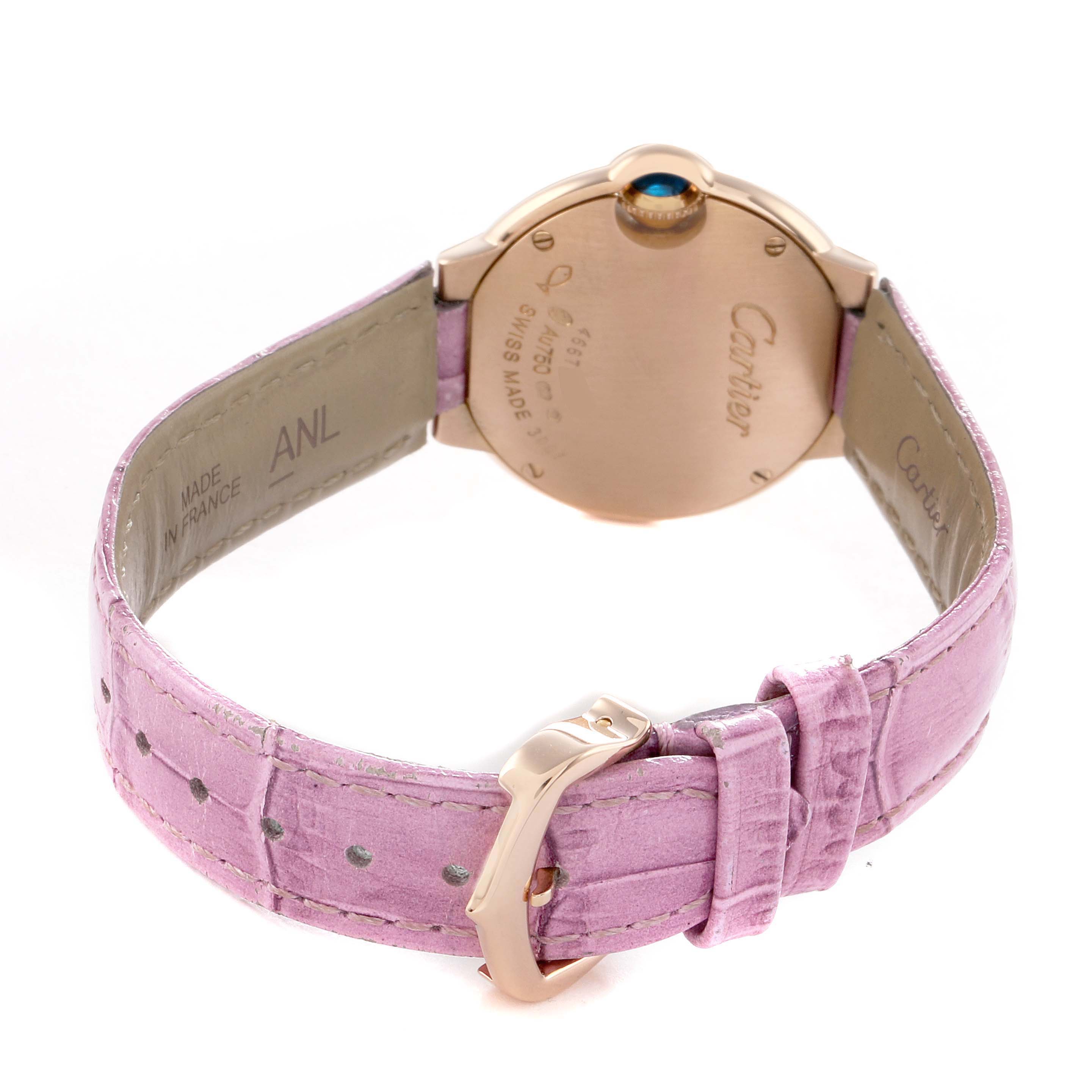 The Cartier Ballon Bleu WE902050 Women's Rose Gold Silver Dial watch is shown from the back, highlighting the case, pink leather strap, and buckle.
