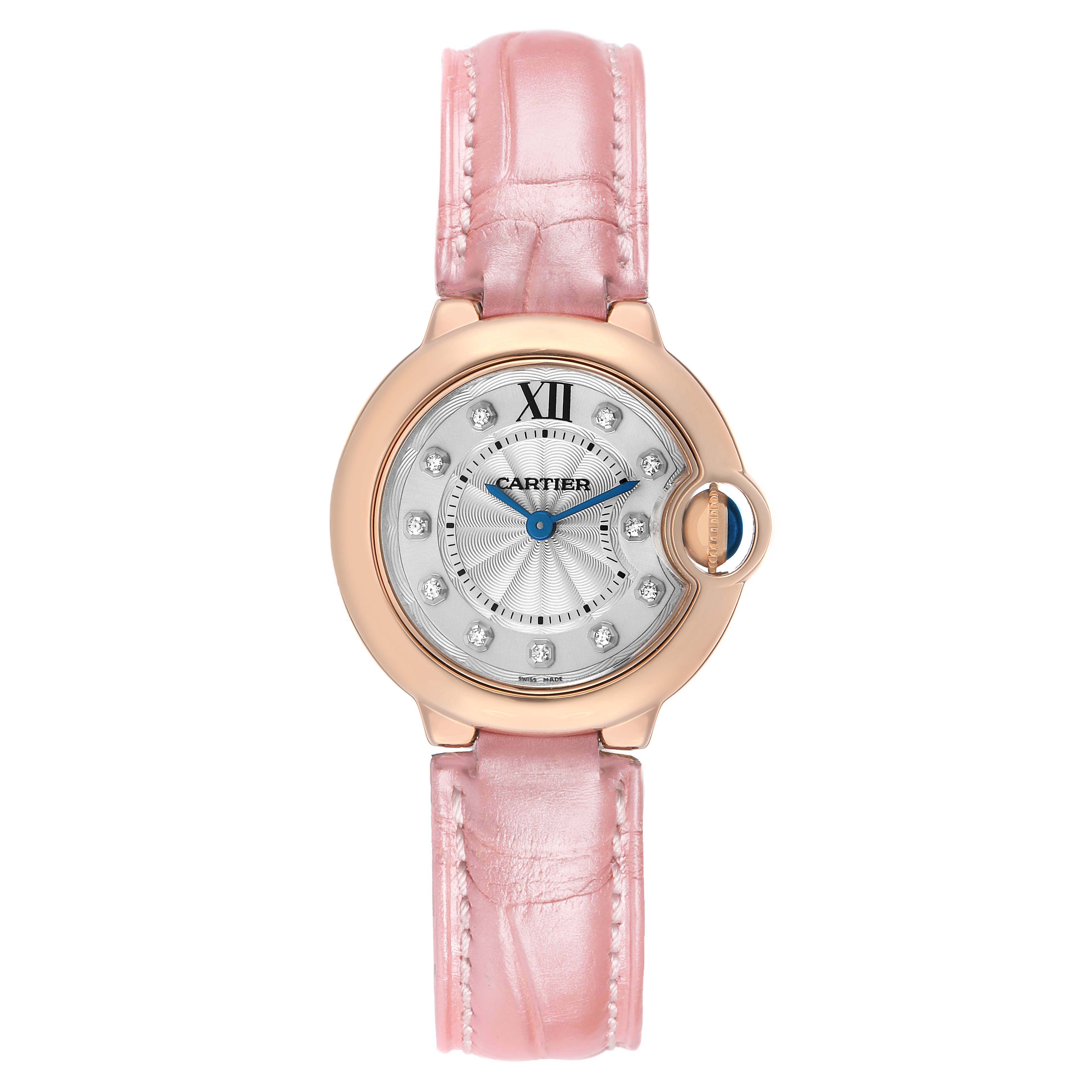 The Cartier Ballon Bleu WE902050 Women's Rose Gold Silver Dial watch is shown from the front, displaying its dial, pink strap, and signature crown.
