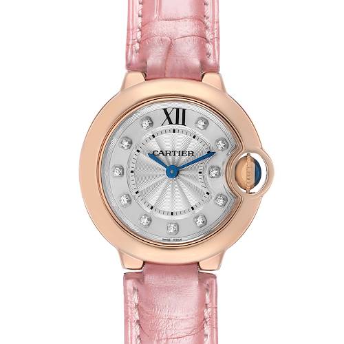 The Cartier Ballon Bleu WE902050 Women's Rose Gold Silver Dial watch is shown from a front view, highlighting its round dial, pink strap, and blue hands.