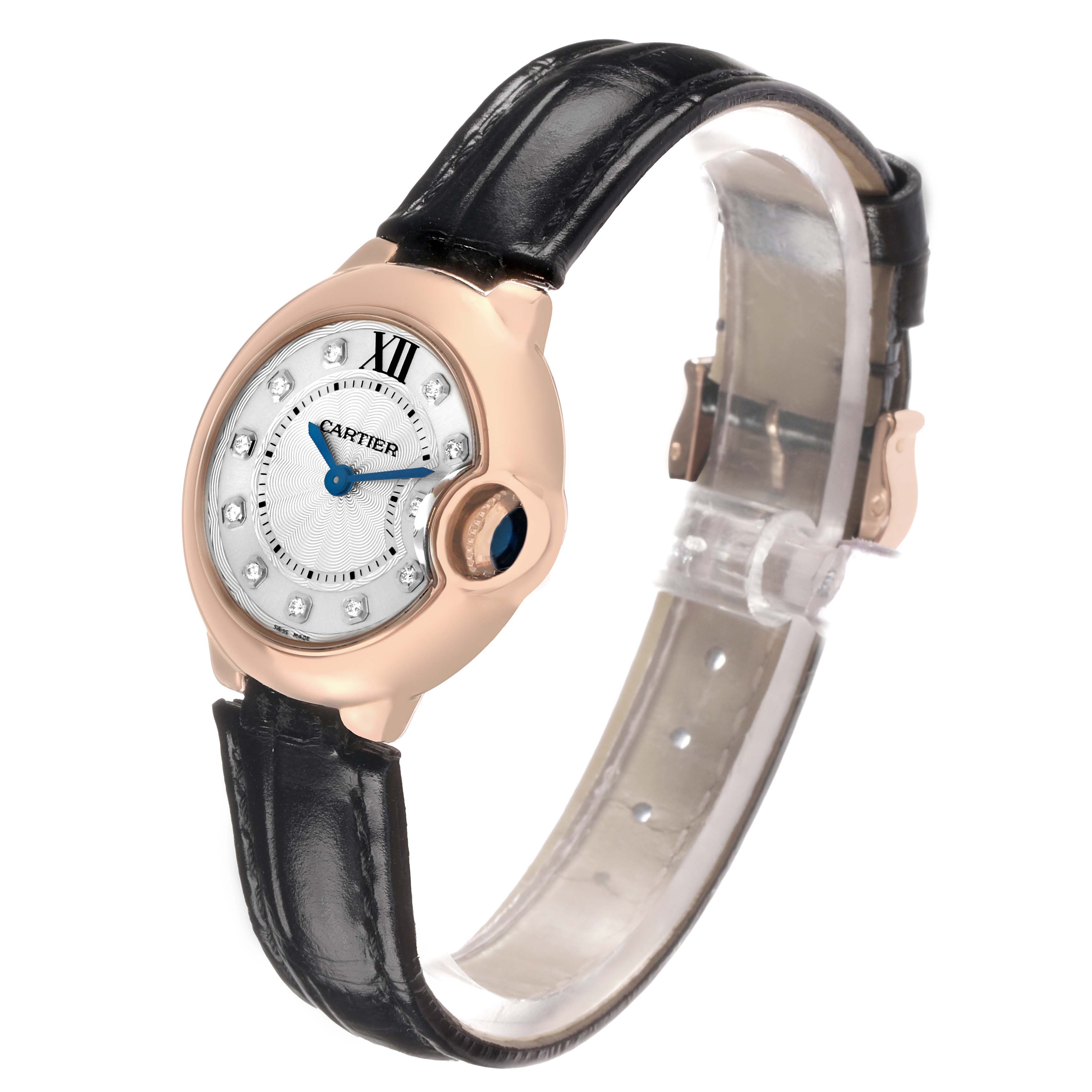 The Cartier Ballon Bleu WJBB0019 Women's Rose Gold Silver Dial watch is shown at a three-quarter angle, displaying the round case, blue cabochon crown, and black leather strap.