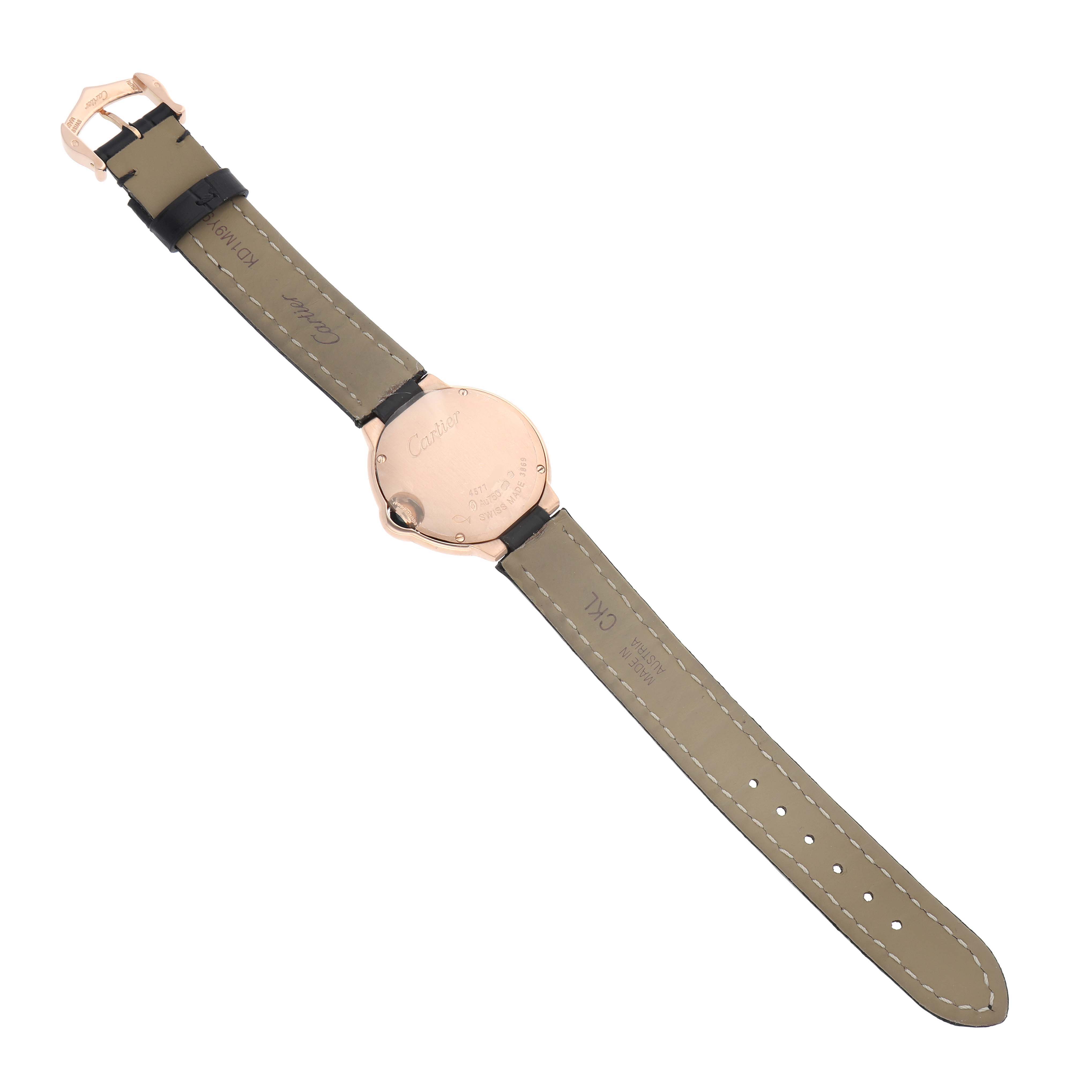 The watch is a Cartier Ballon Bleu WJBB0019 Women's Rose Gold Silver Dial shown from the back, displaying its case back and leather strap with buckle.