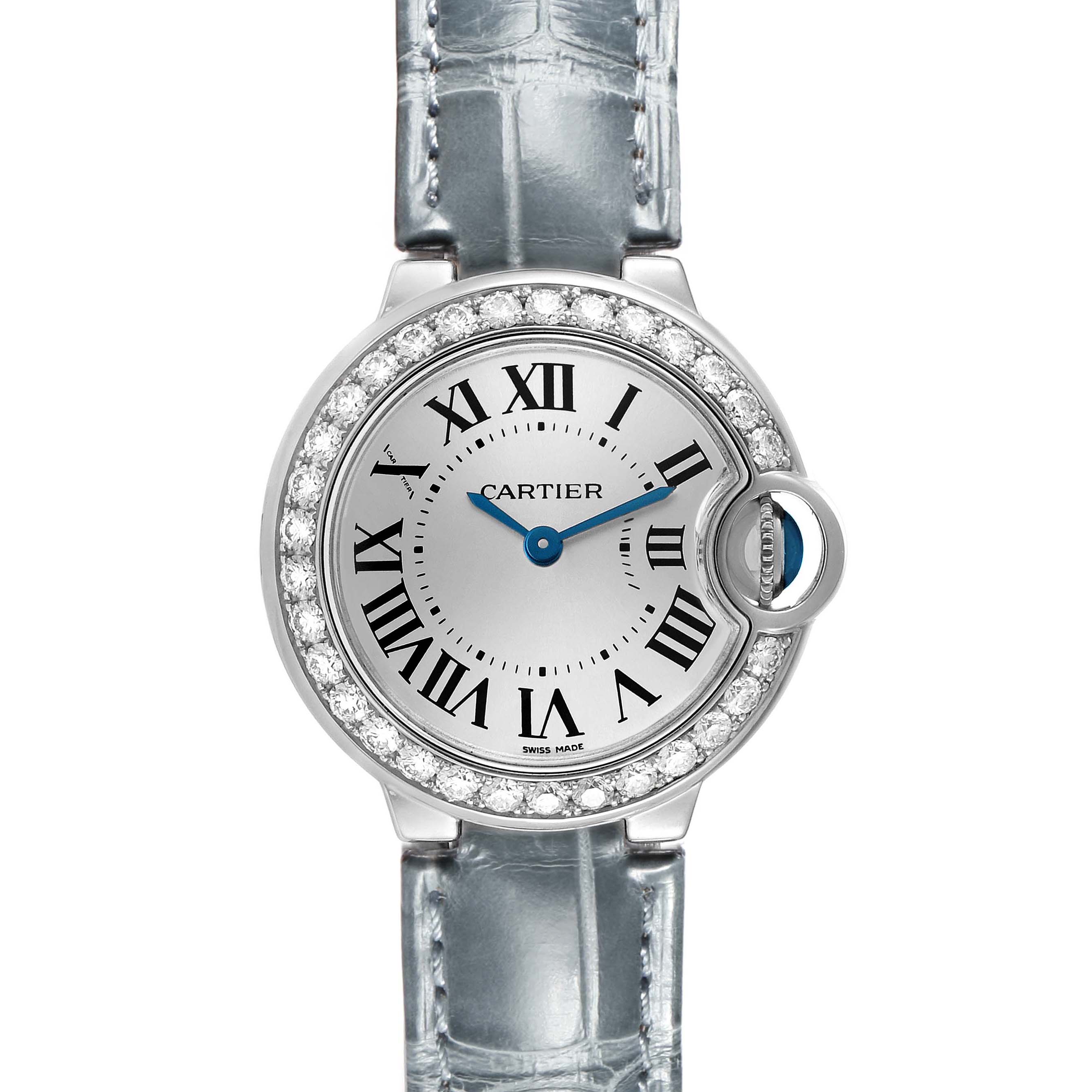 The Cartier Ballon Bleu WE900351 Women's White Gold Silver Dial watch is shown from the front, highlighting its round face, Roman numerals, blue hands, and jeweled bezel.