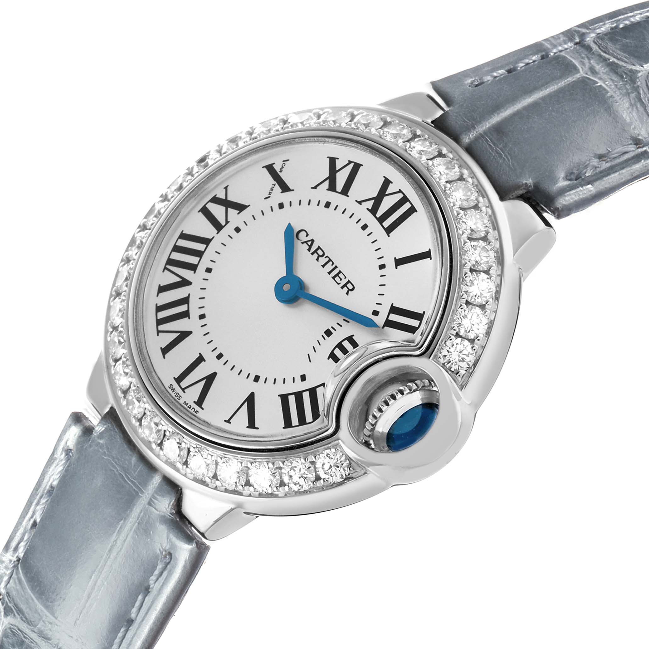 The Cartier Ballon Bleu WE900351 Women's White Gold Silver Dial watch is shown at an angled view, highlighting the face, bezel with diamonds, and blue cabochon crown.