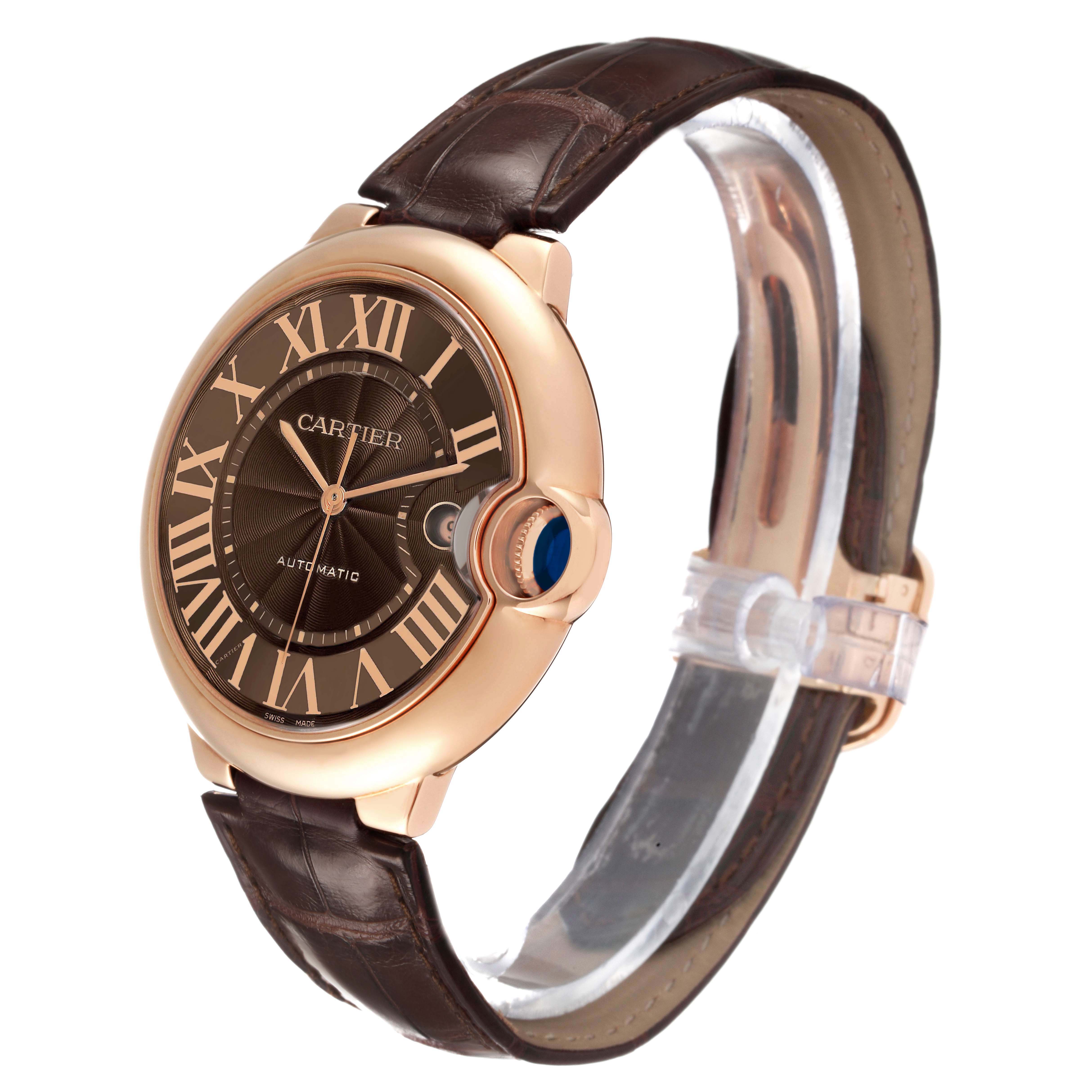 The Cartier Ballon Bleu W6920037 Men's Rose Gold Brown Dial watch is shown at an angled side view, highlighting the dial, crown, and leather strap.