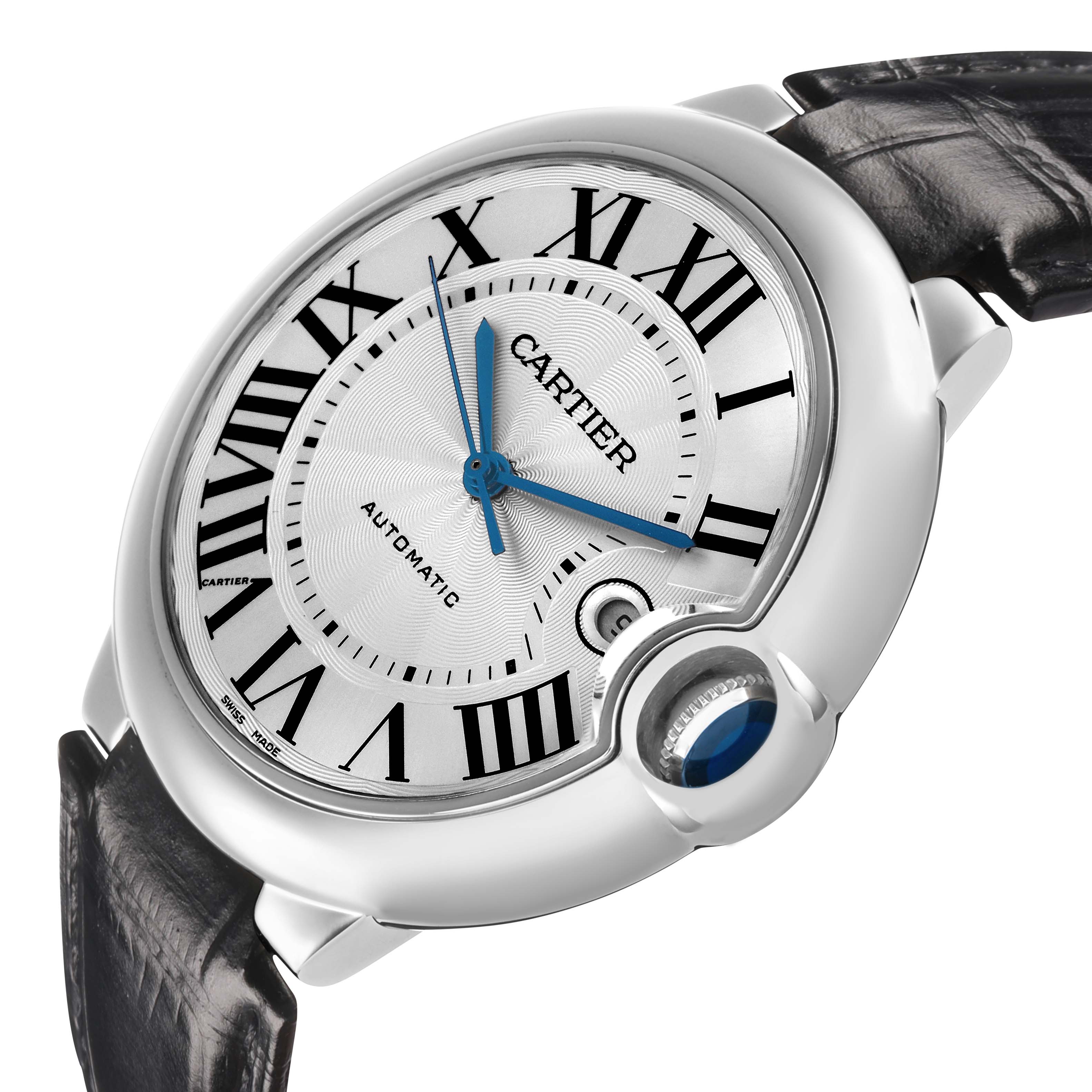 The Ballon Bleu by Cartier is shown at an angled view, displaying its dial, Roman numerals, blue hands, and the crown with a blue cabochon.