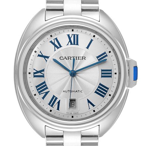 The Cartier Clé watch is shown from the front, displaying its dial with blue Roman numerals, hands, and a date window.
