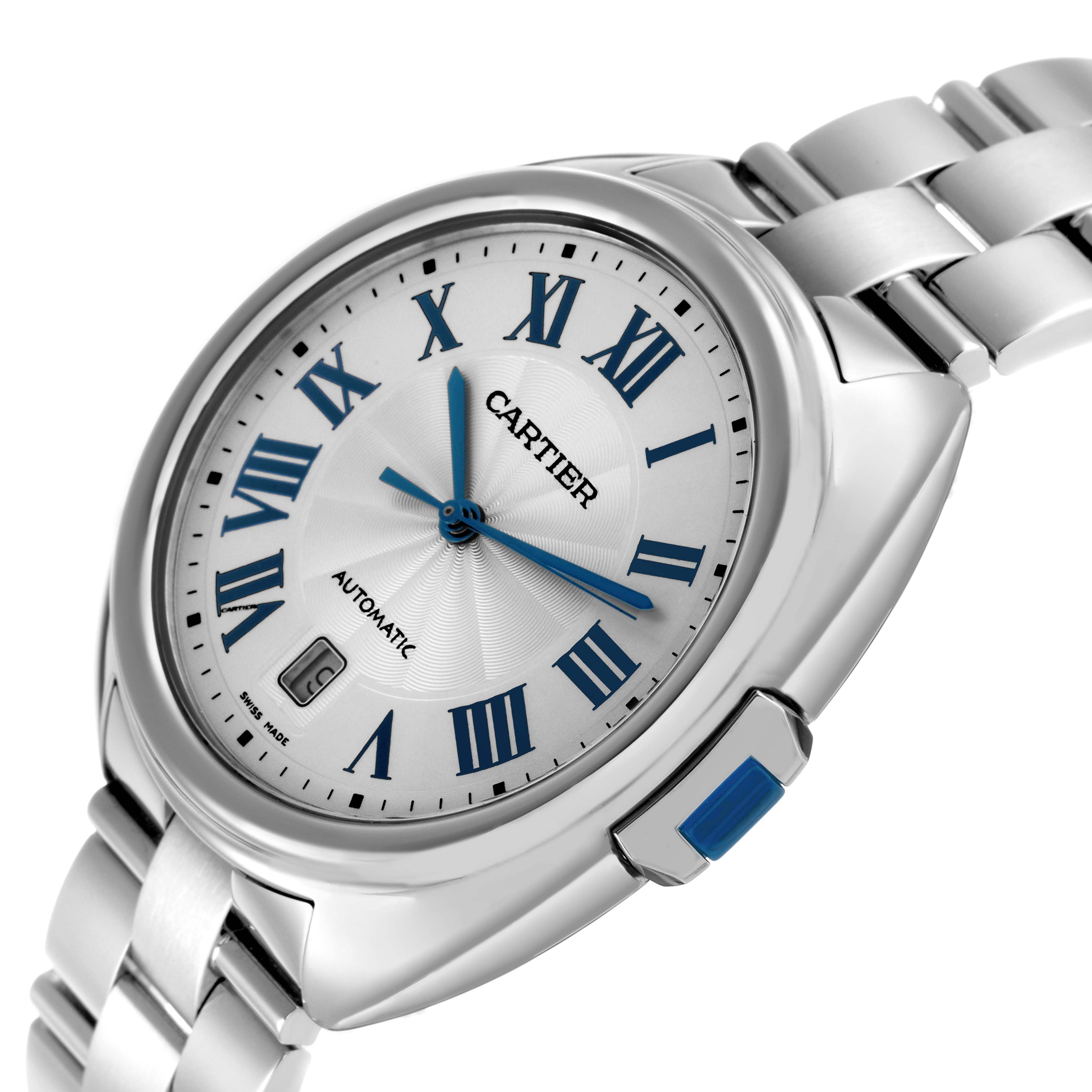 The Cartier Clé watch is shown at an angled view highlighting the dial, blue hands, and metal bracelet.