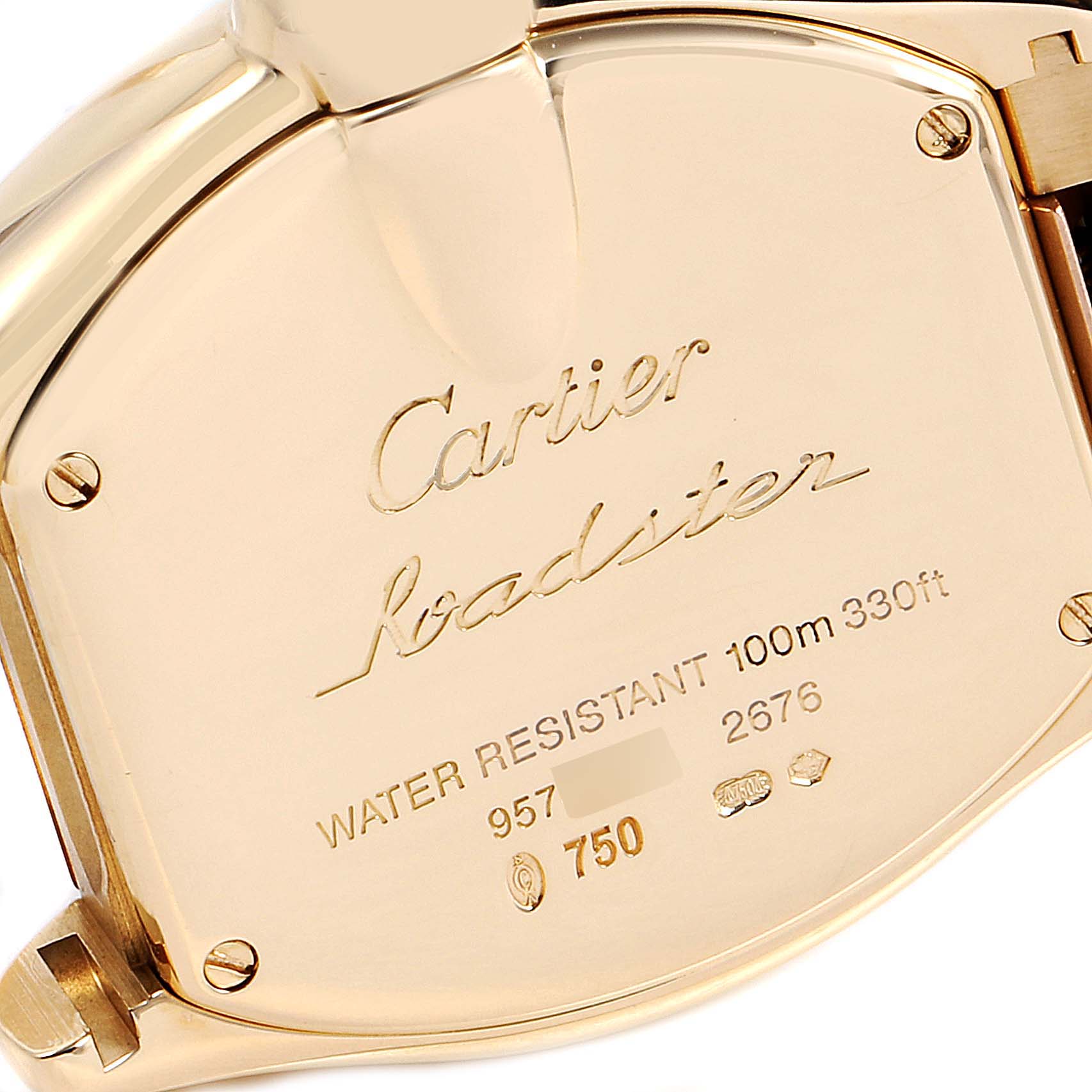 The image shows the back case of a Cartier Roadster W62018V1 Women's Yellow Gold Silver Dial W62018V1 Women's Yellow Gold Silver Dial watch at an angled view, highlighting its engravings and markings.