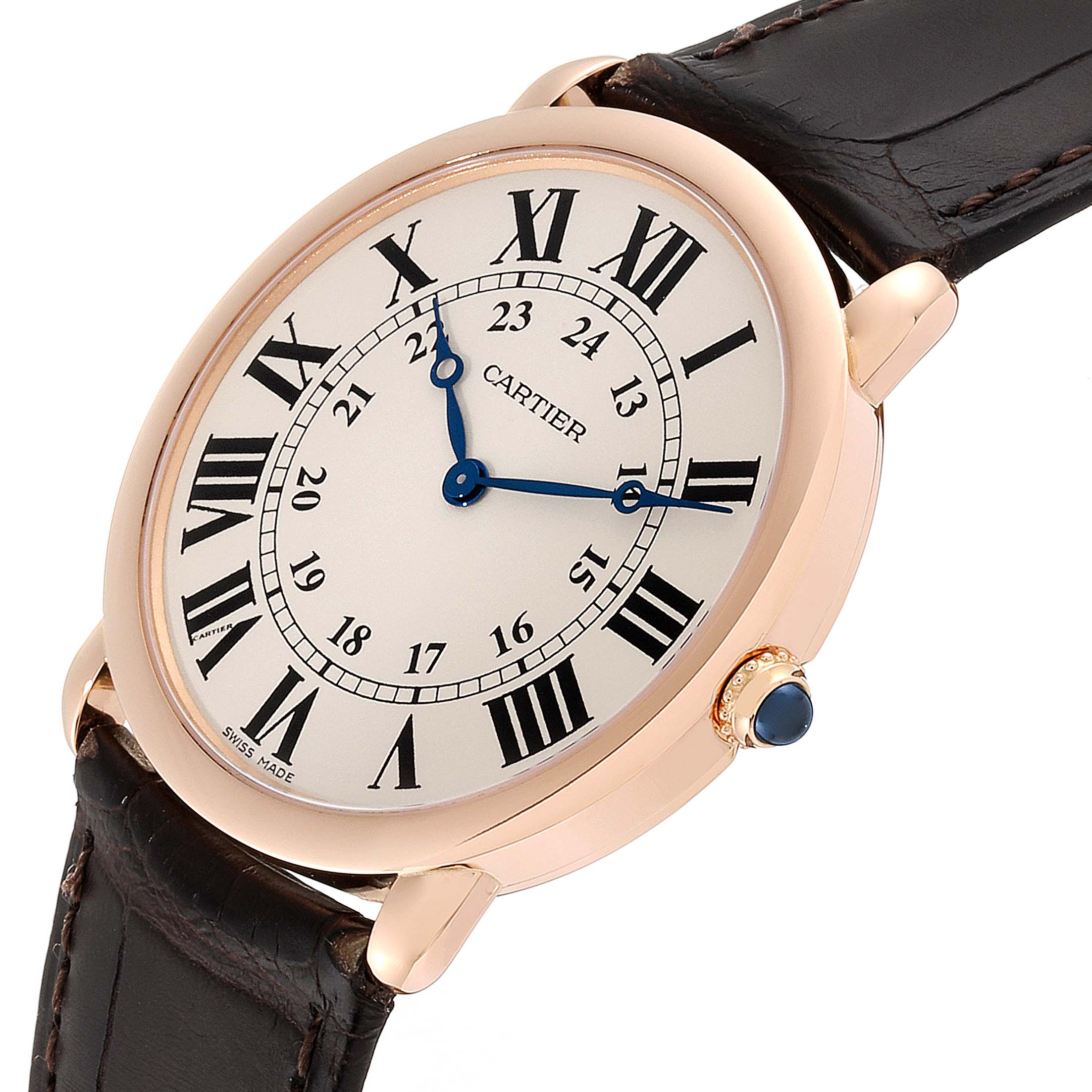 This image shows a close-up of a Cartier Ronde W6800251 Men's Rose Gold Silver Dial W6800251 Men's Rose Gold Silver Dial watch, capturing the dial, case, crown, and part of the leather strap.