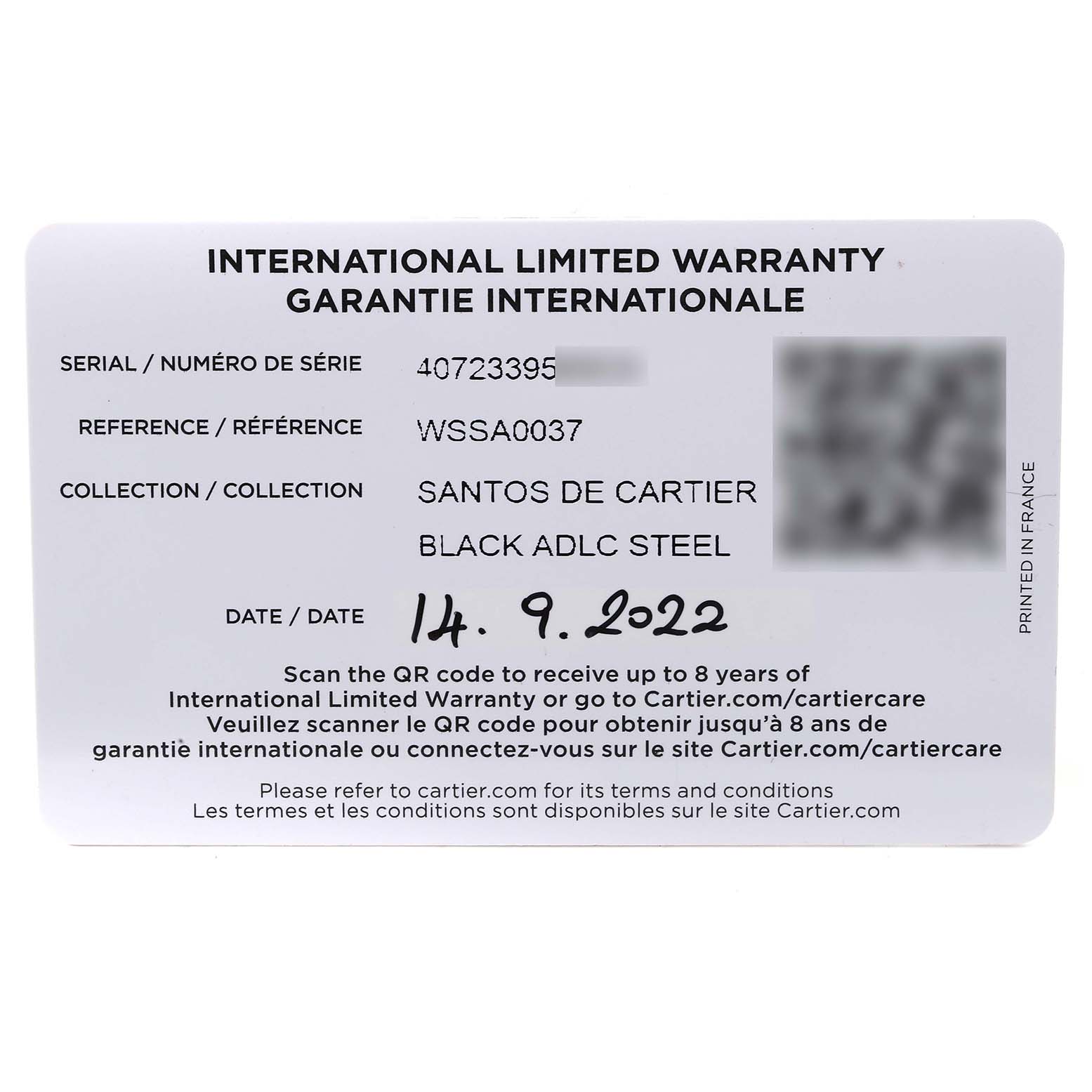 The image shows an international limited warranty card for the Cartier Santos WSSA0037 Men's Stainless Steel Grey Dial WSSA0037 Men's Stainless Steel Grey Dial de Cartier Black ADLC Steel, including its serial and reference numbers.