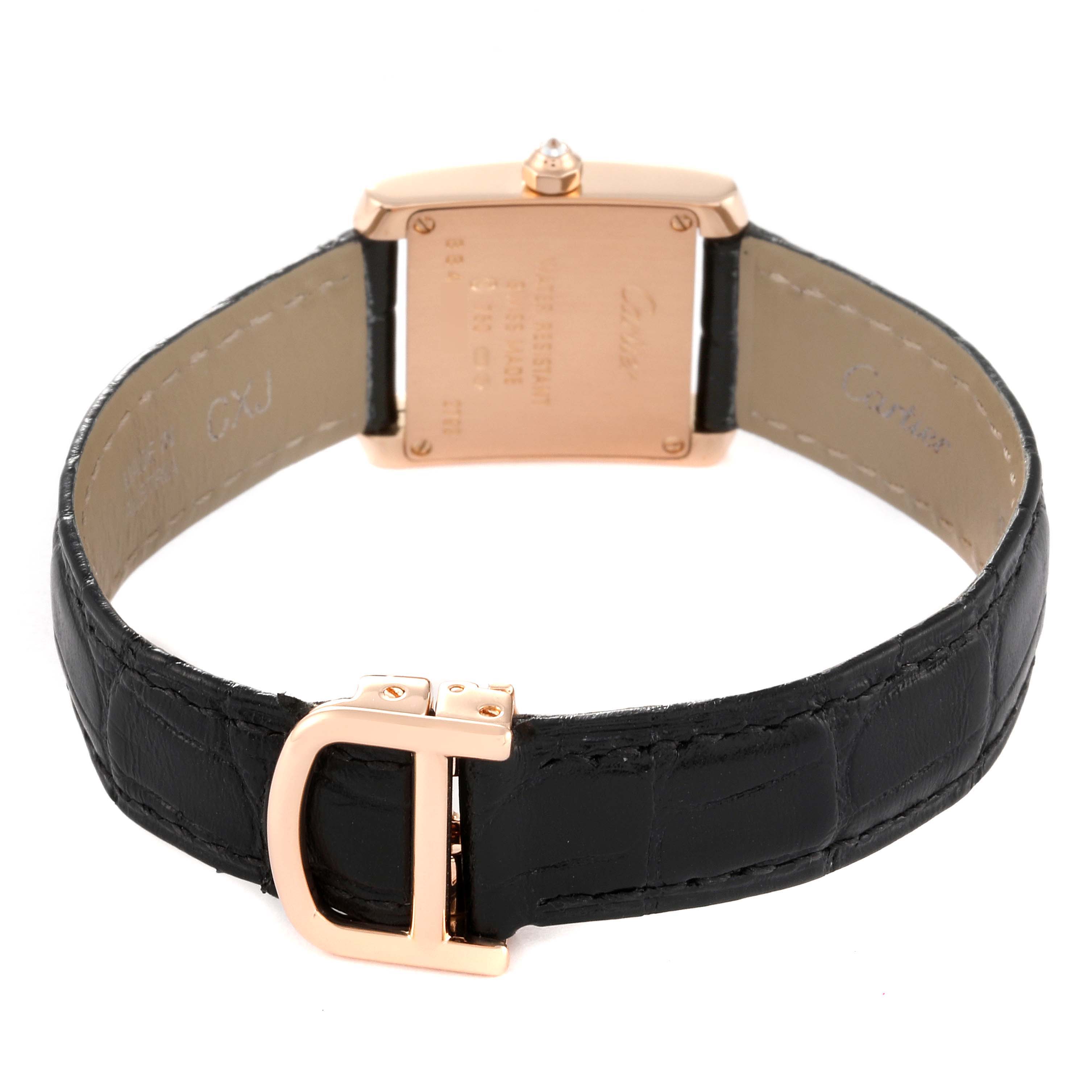 The image shows the back view of a Cartier Tank Francaise WE104531 Women's Rose Gold Silver Dial WE104531 Women's Rose Gold Silver Dial watch with a black leather strap and a gold buckle.