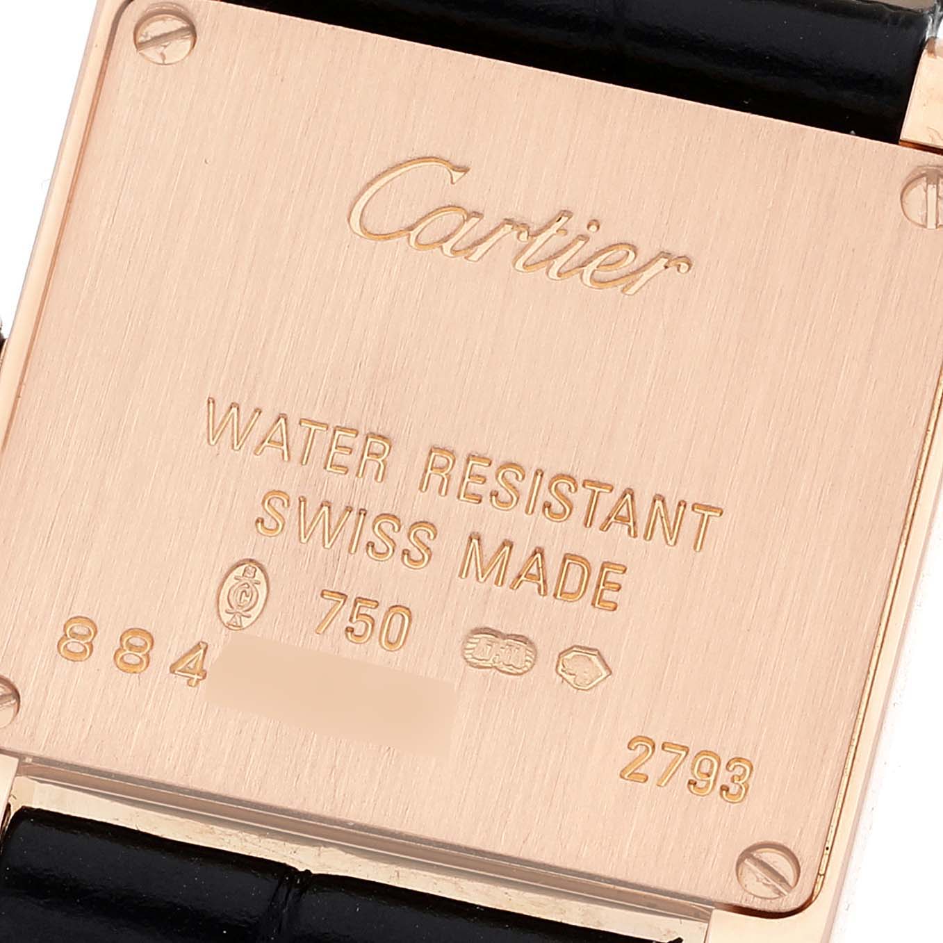 The image shows the back case of a Cartier Tank Française watch, highlighting its inscriptions and leather strap.