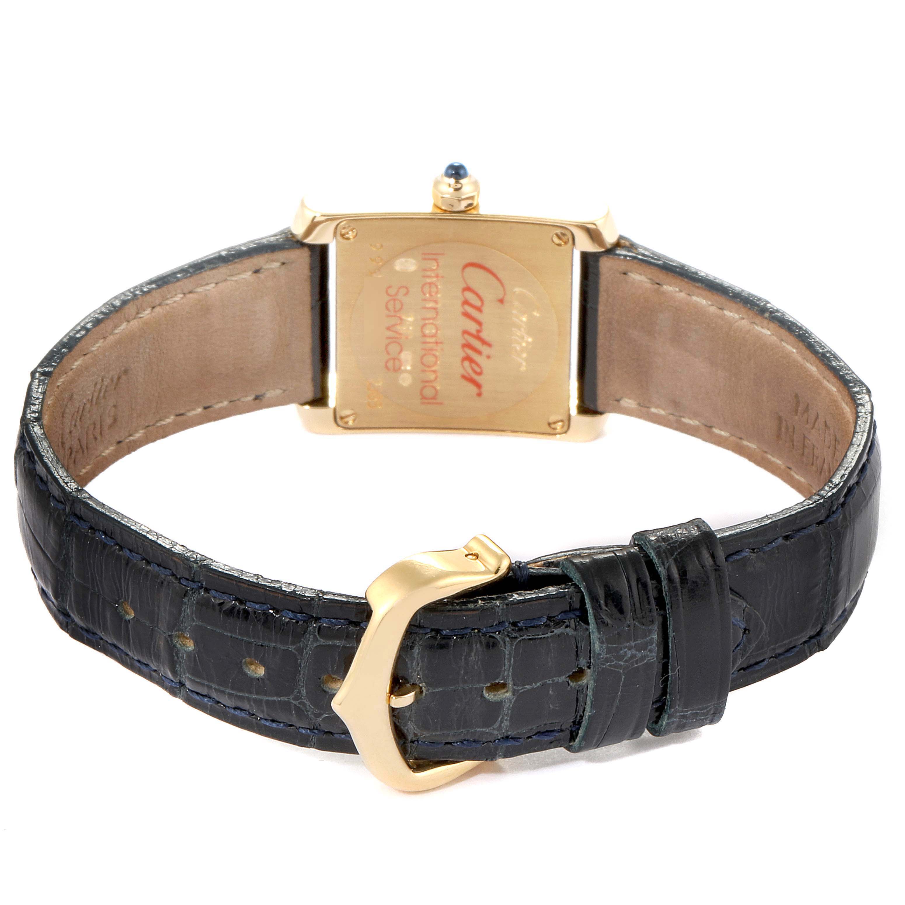 The image shows the back view of a Cartier Tank Francaise W5000256 Women's Yellow Gold Silver Dial W5000256 Women's Yellow Gold Silver Dial watch, highlighting the caseback, strap, and clasp.