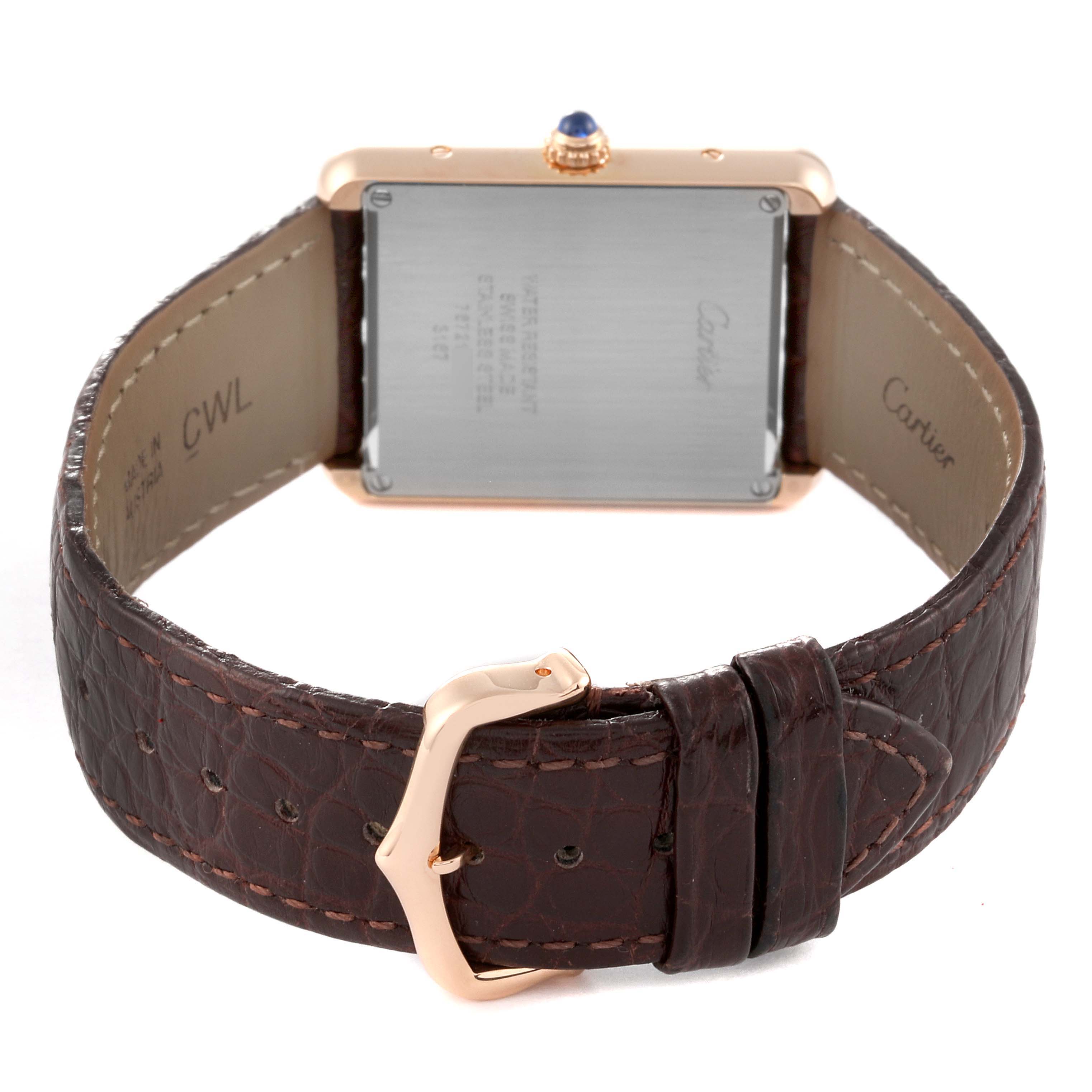 The image shows the back of the Cartier Tank Solo W5200025 Men
s Rose Gold Silver Dial W5200025 Men
s Rose Gold Silver Dial watch, showcasing the rear casing and brown leather strap with buckle.