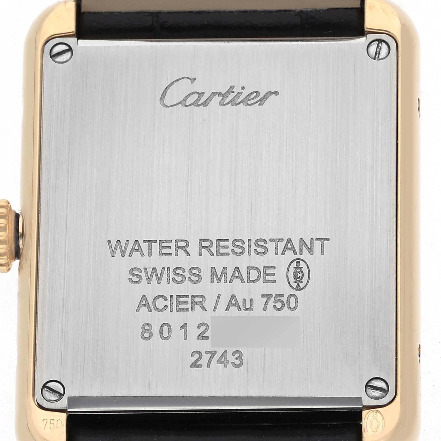 The image shows the back of a Cartier Tank Solo W1018755 Women's Steel and Gold (two tone) Silver Dial watch, featuring branding and specifications.