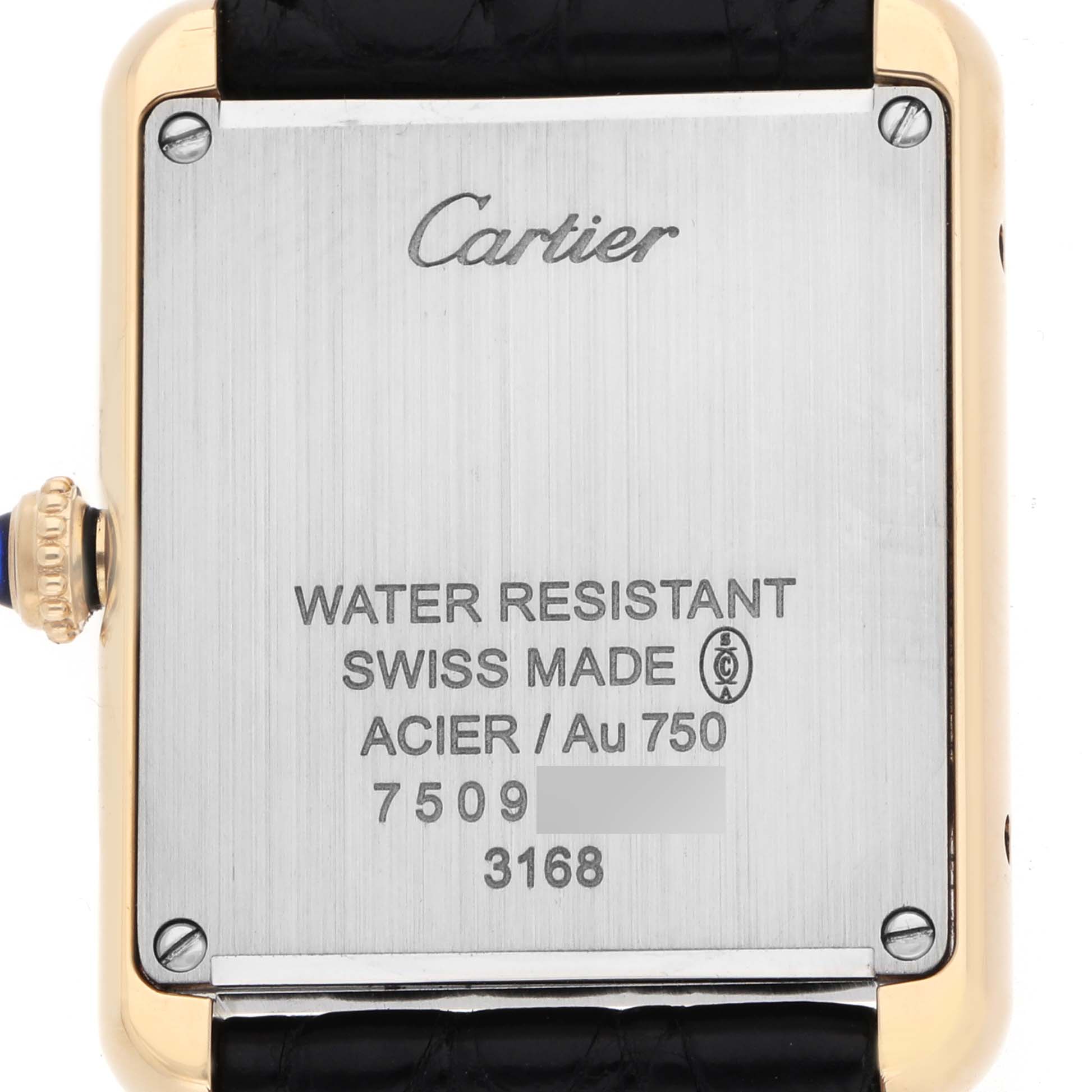 The image shows the back of a Cartier Tank Solo W5200002 Women's Steel and Gold (two tone) Silver Dial watch, highlighting engraving details and the crown.